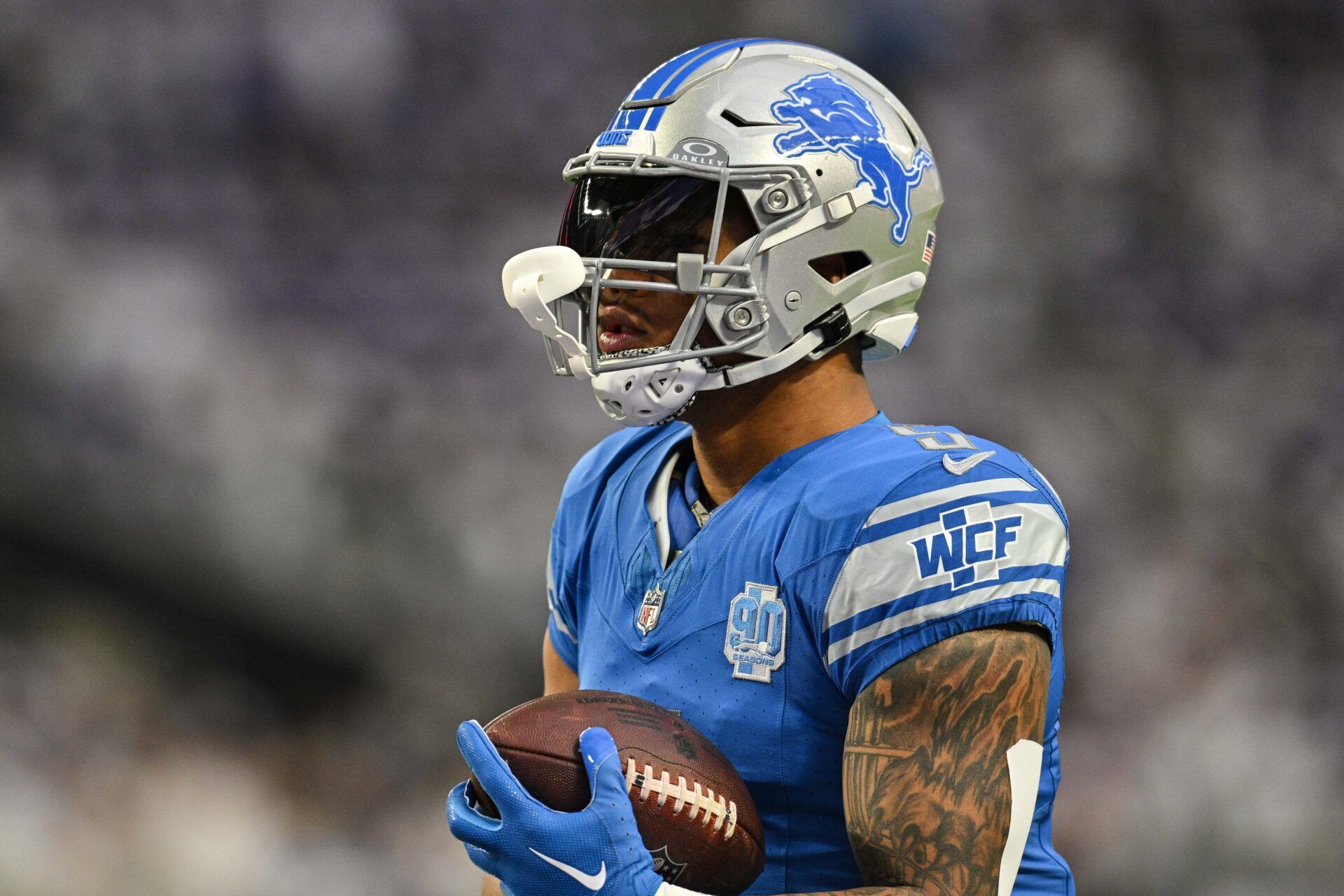 Detroit Lions running back David Montgomery (5) warms up before the game against the Minnesota Vikings at U.S. Bank Stadium.