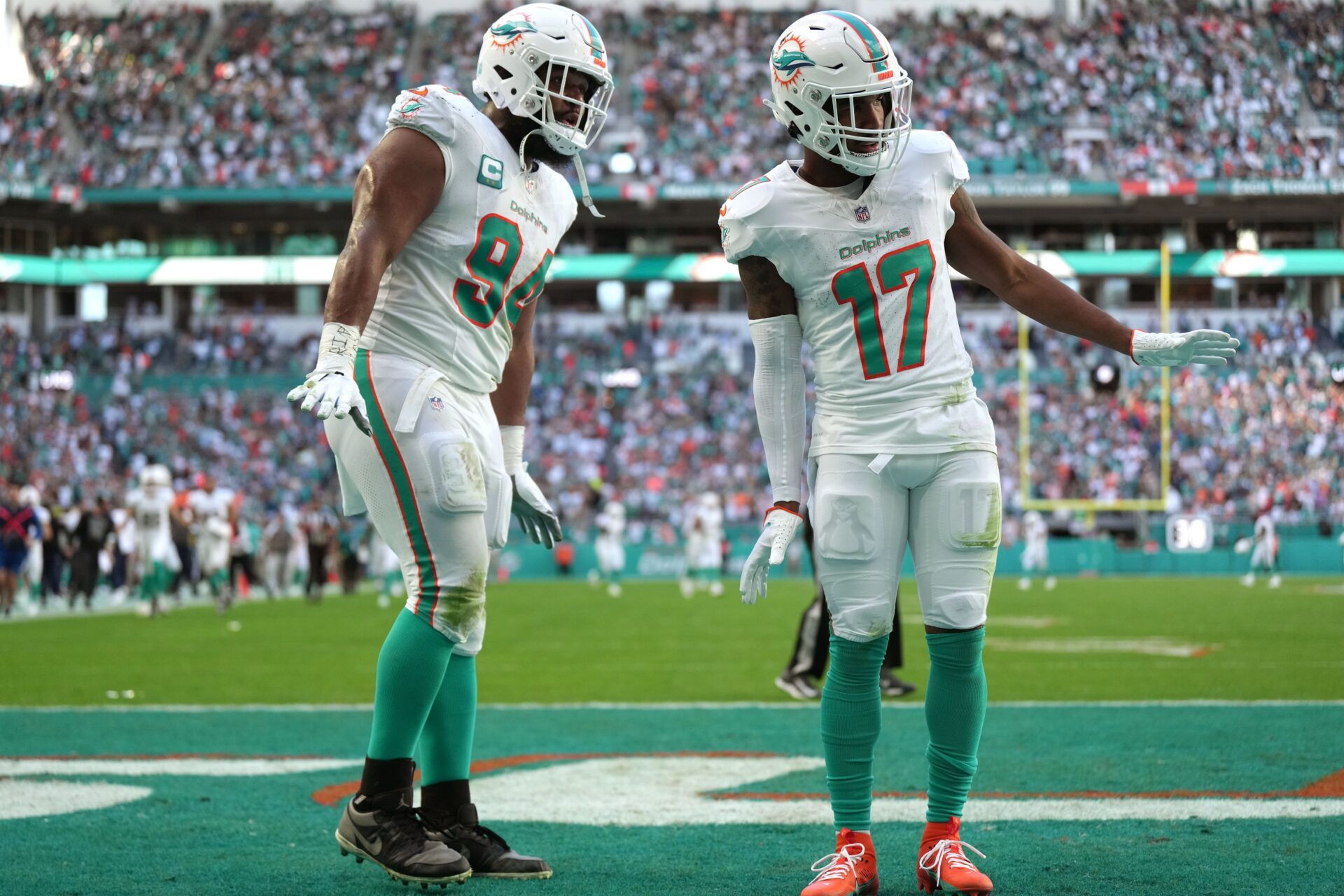 Jaylen Waddle (17) with Miami Dolphins defensive tackle Christian Wilkins (94) after scoring a touchdown against the New York Jets.