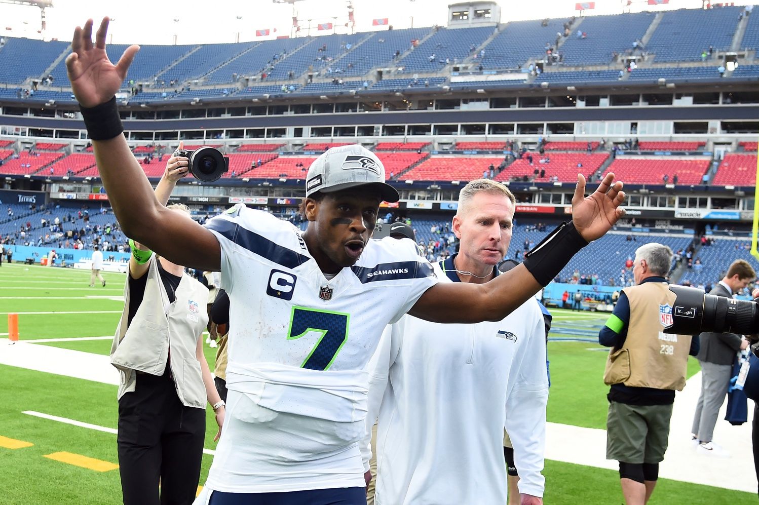 Seattle Seahawks quarterback Geno Smith (7) celebrates as he leaves the field after a win against the Tennessee Titans at Nissan Stadium.