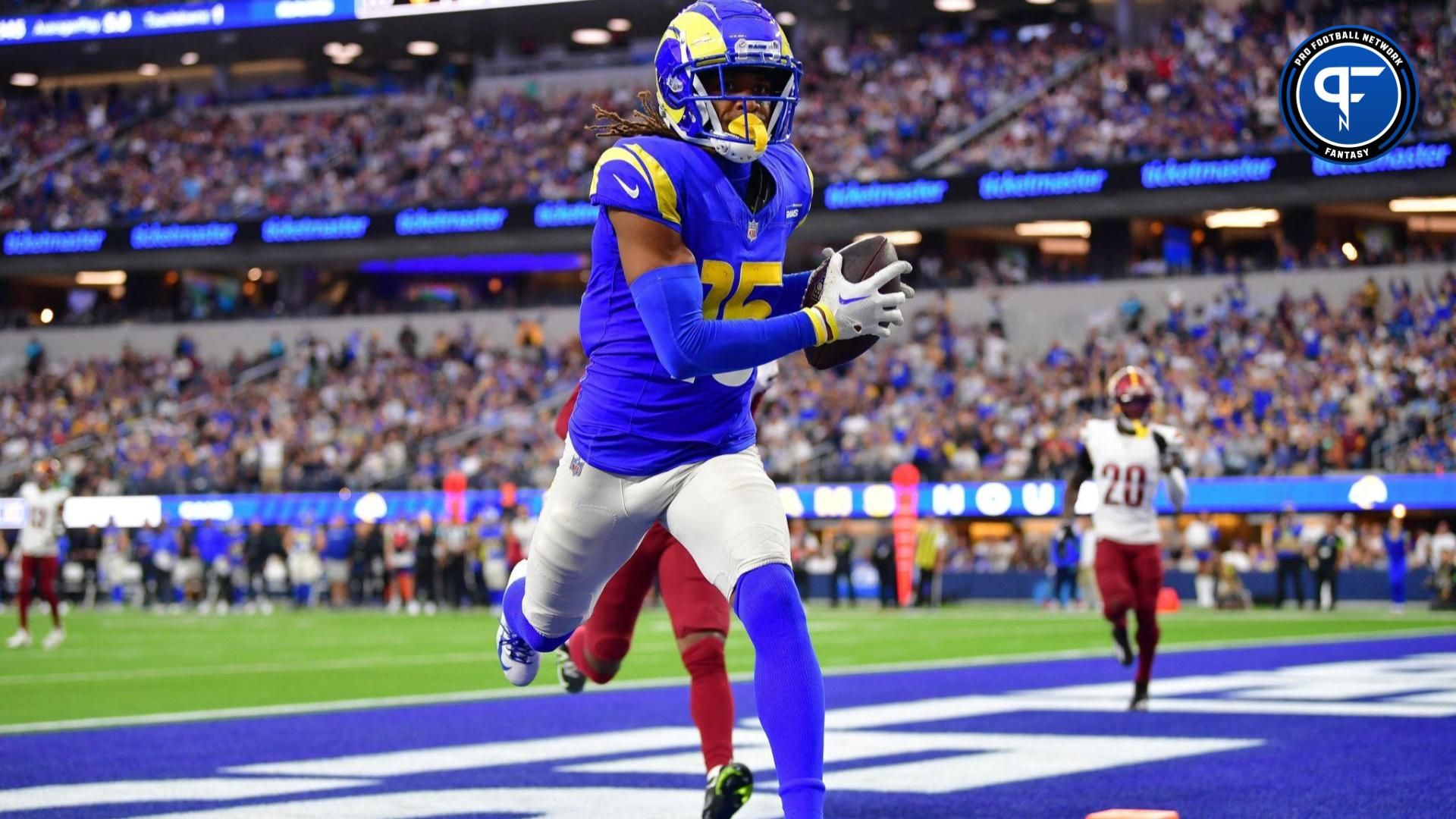 Los Angeles Rams wide receiver Demarcus Robinson (15) catches a pass for a touchdown ahead of Washington Commanders safety Percy Butler (35) during the second half at SoFi Stadium.