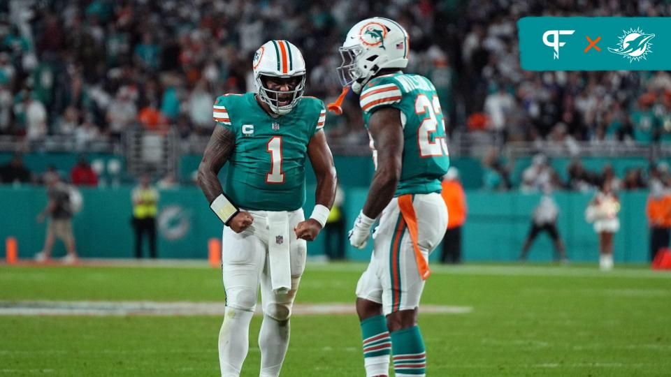 Miami Dolphins quarterback Tua Tagovailoa (1) celebrates after Miami Dolphins running back Jeff Wilson Jr. (23) rushed for a first down against the Dallas Cowboys during the second half at Hard Rock Stadium.