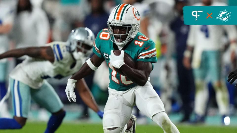 Miami Dolphins wide receiver Tyreek Hill (10) runs with the ball after a catch during the second half against the Dallas Cowboys at Hard Rock Stadium.