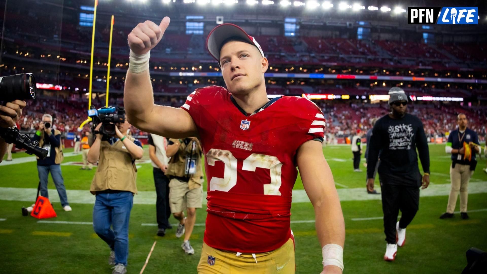 San Francisco 49ers running back Christian McCaffrey (23) celebrates after beating the Arizona Cardinals at State Farm Stadium.