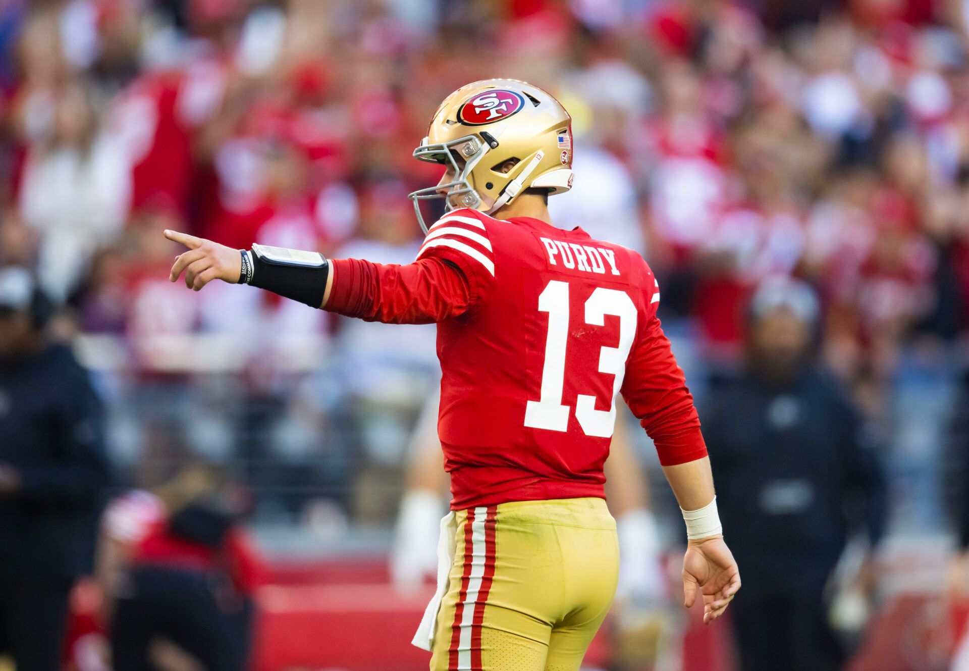 San Francisco 49ers quarterback Brock Purdy (13) reacts after a touchdown against the Arizona Cardinals at State Farm Stadium.