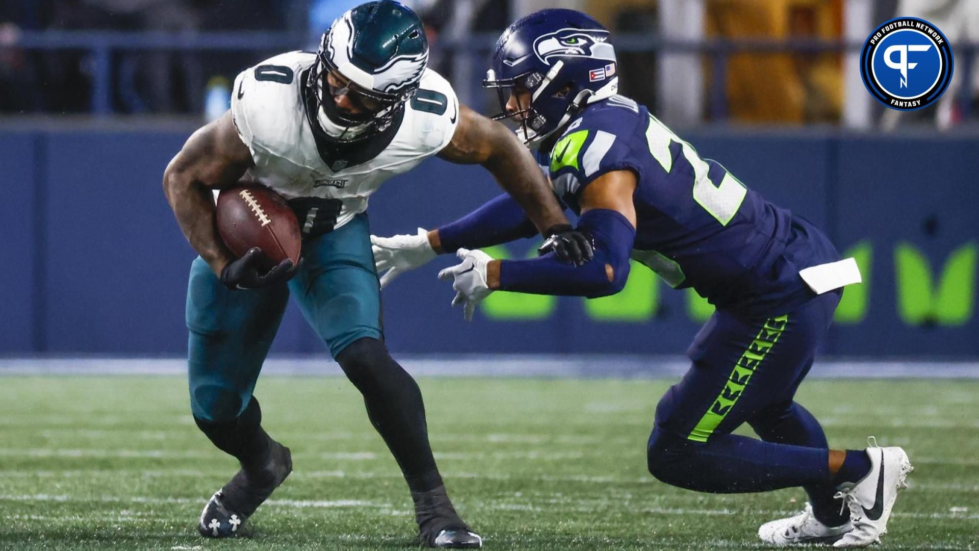 Philadelphia Eagles running back D'Andre Swift (0) breaks a tackle attempt by Seattle Seahawks safety Julian Love (20) during the fourth quarter at Lumen Field.