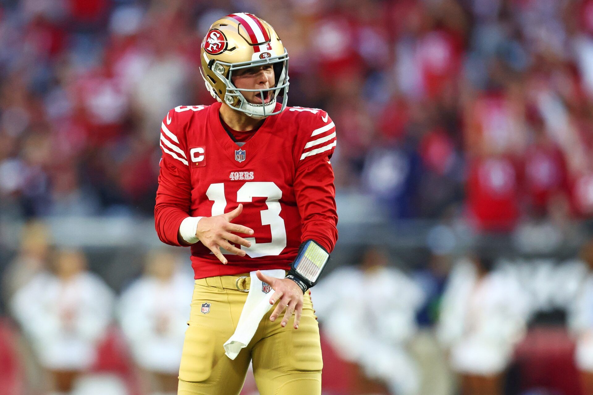 San Francisco 49ers quarterback Brock Purdy (13) celebrates after a play during the fourth quarter against the Arizona Cardinals at State Farm Stadium.