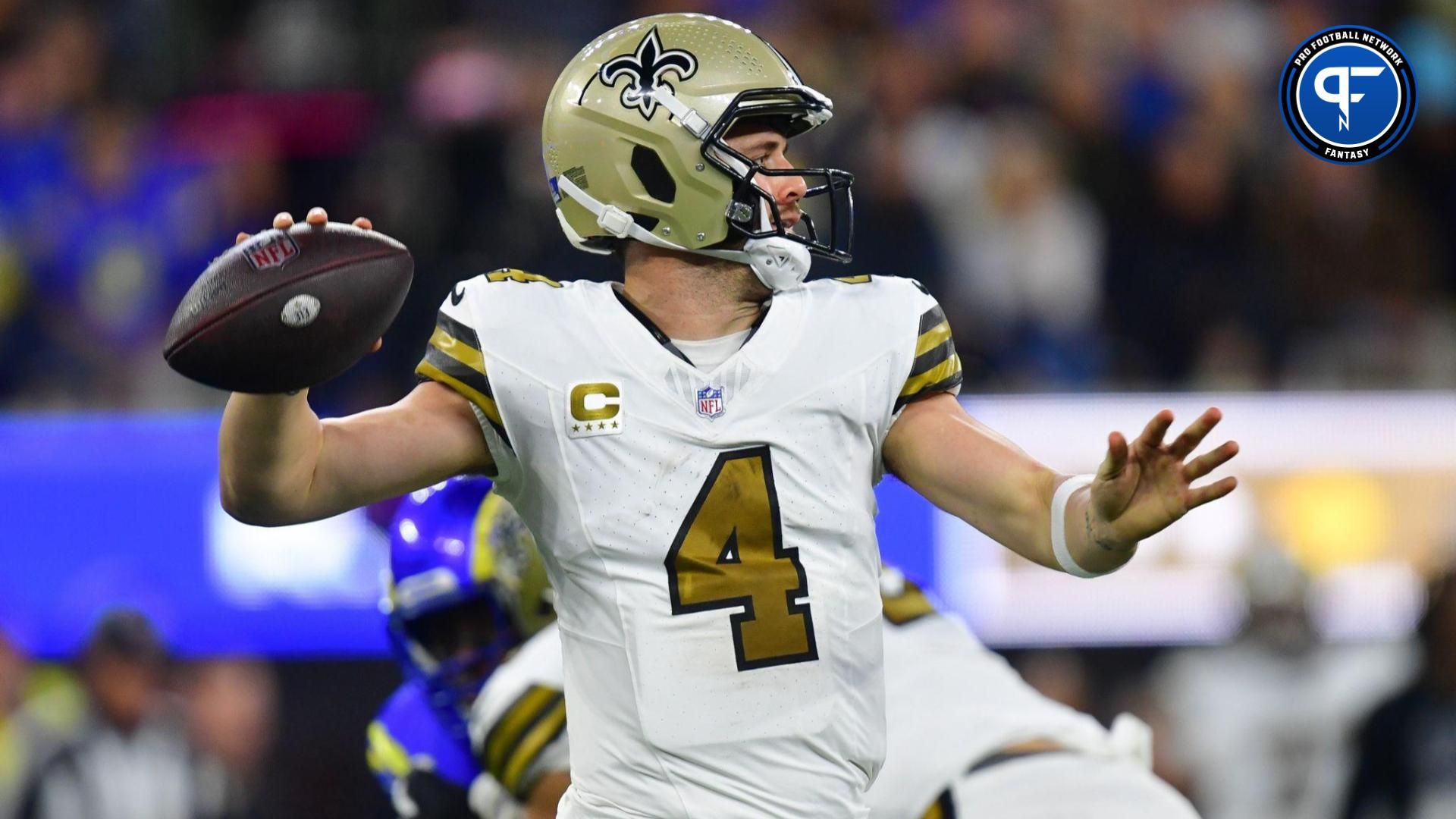 New Orleans Saints quarterback Derek Carr (4) throws against the Los Angeles Rams during the first half at SoFi Stadium.