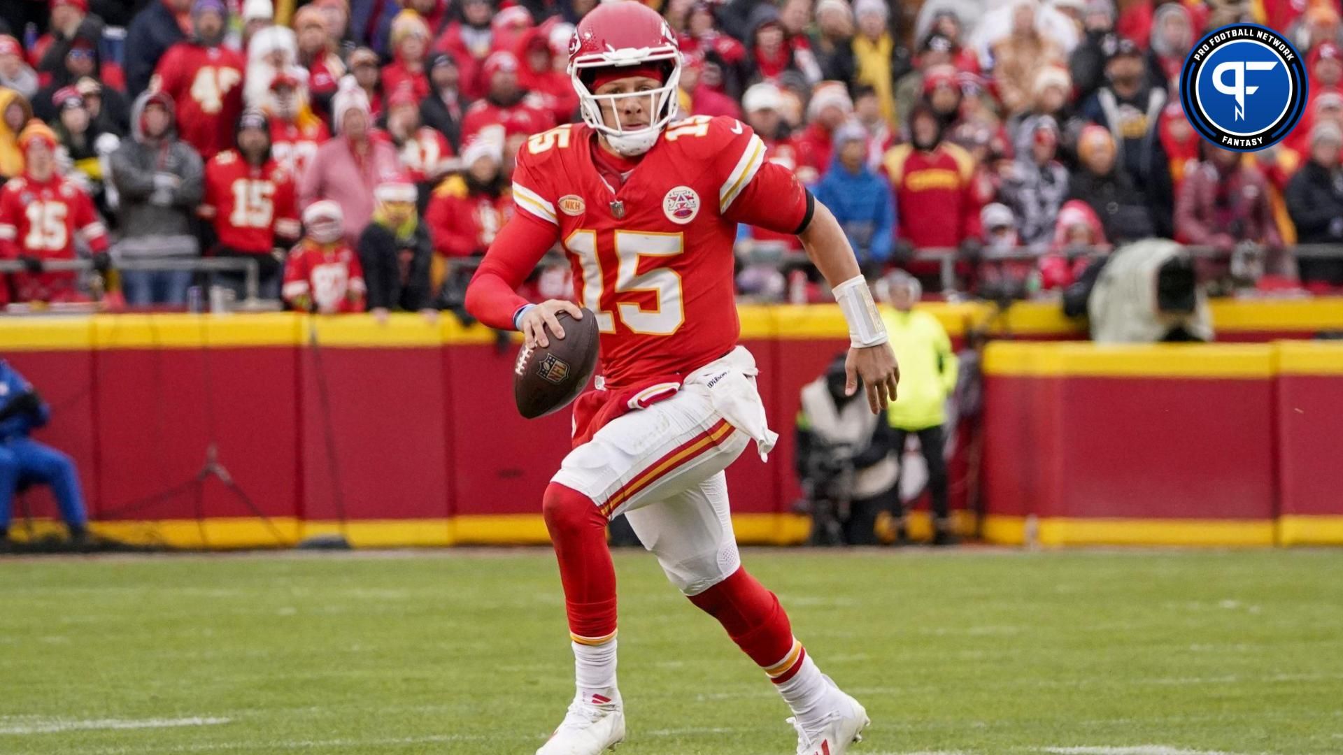 Kansas City Chiefs quarterback Patrick Mahomes (15) runs the ball against the Las Vegas Raiders during the first half at GEHA Field at Arrowhead Stadium.