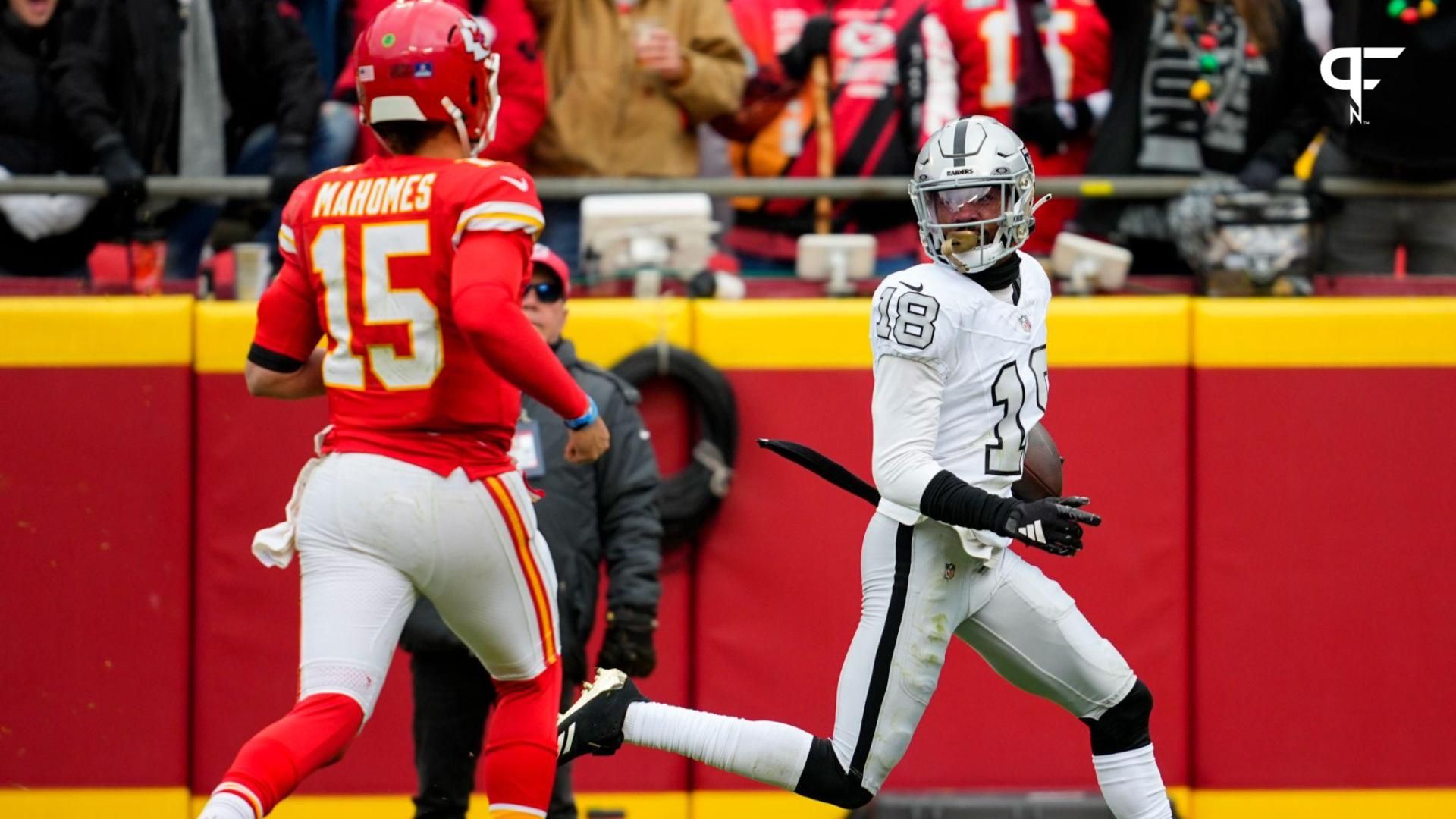 Las Vegas Raiders cornerback Jack Jones (18) returns an interception for a touchdown against Kansas City Chiefs quarterback Patrick Mahomes (15) during the first half at GEHA Field at Arrowhead Stadium.