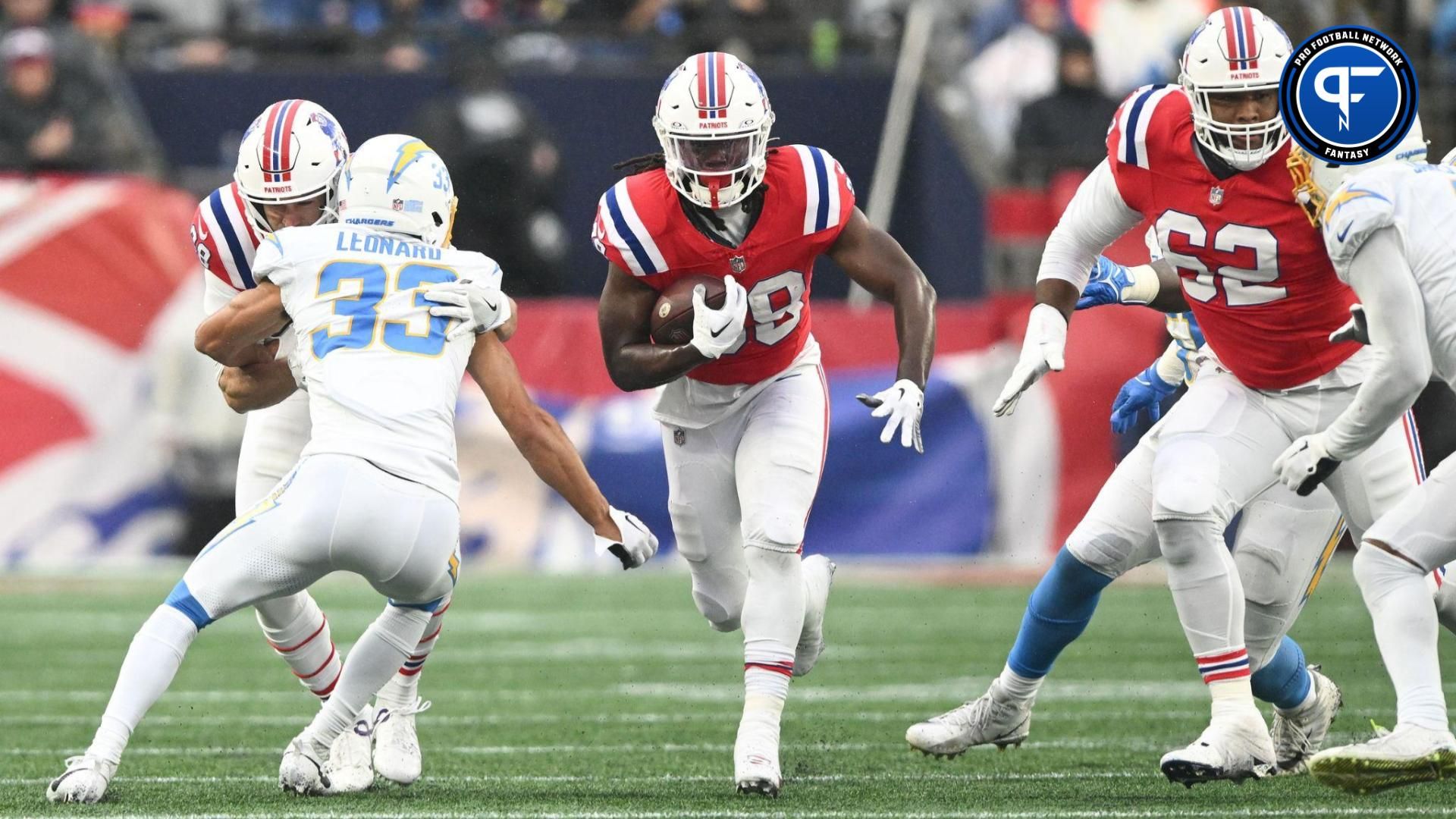 New England Patriots running back Rhamondre Stevenson (38) rushes against the Los Angeles Chargers during the first half at Gillette Stadium