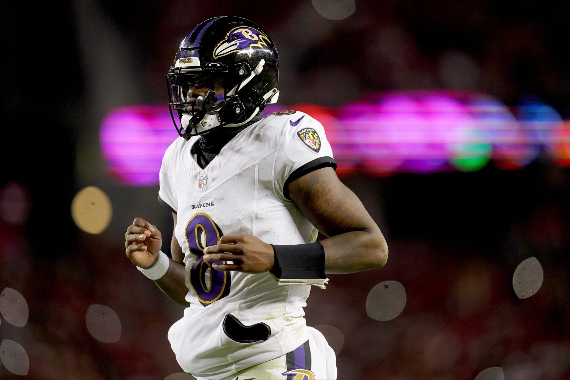 Baltimore Ravens quarterback Lamar Jackson (8) during timeout against the San Francisco 49ers in the third quarter at Levi's Stadium.