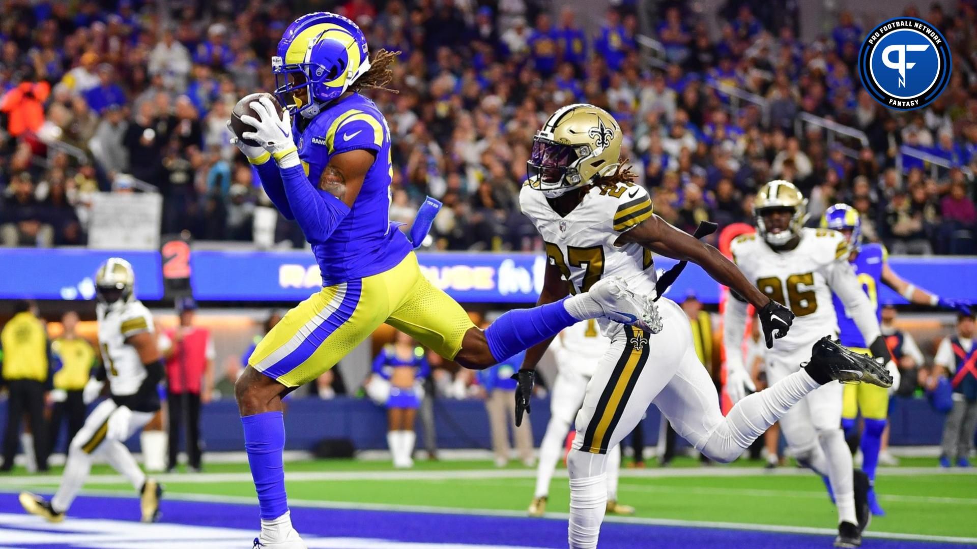 Los Angeles Rams wide receiver Demarcus Robinson (15) catches a touchdown pass ahead of New Orleans Saints cornerback Isaac Yiadom (27) during the first half at SoFi Stadium.