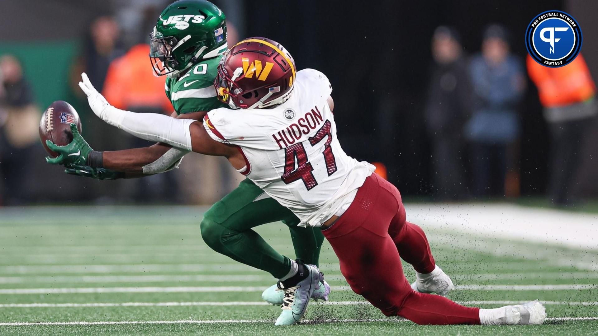 Washington Commanders LB Khaleke Hudson (47) breaks up a pass intended for New York Jets RB Breece Hall (20).