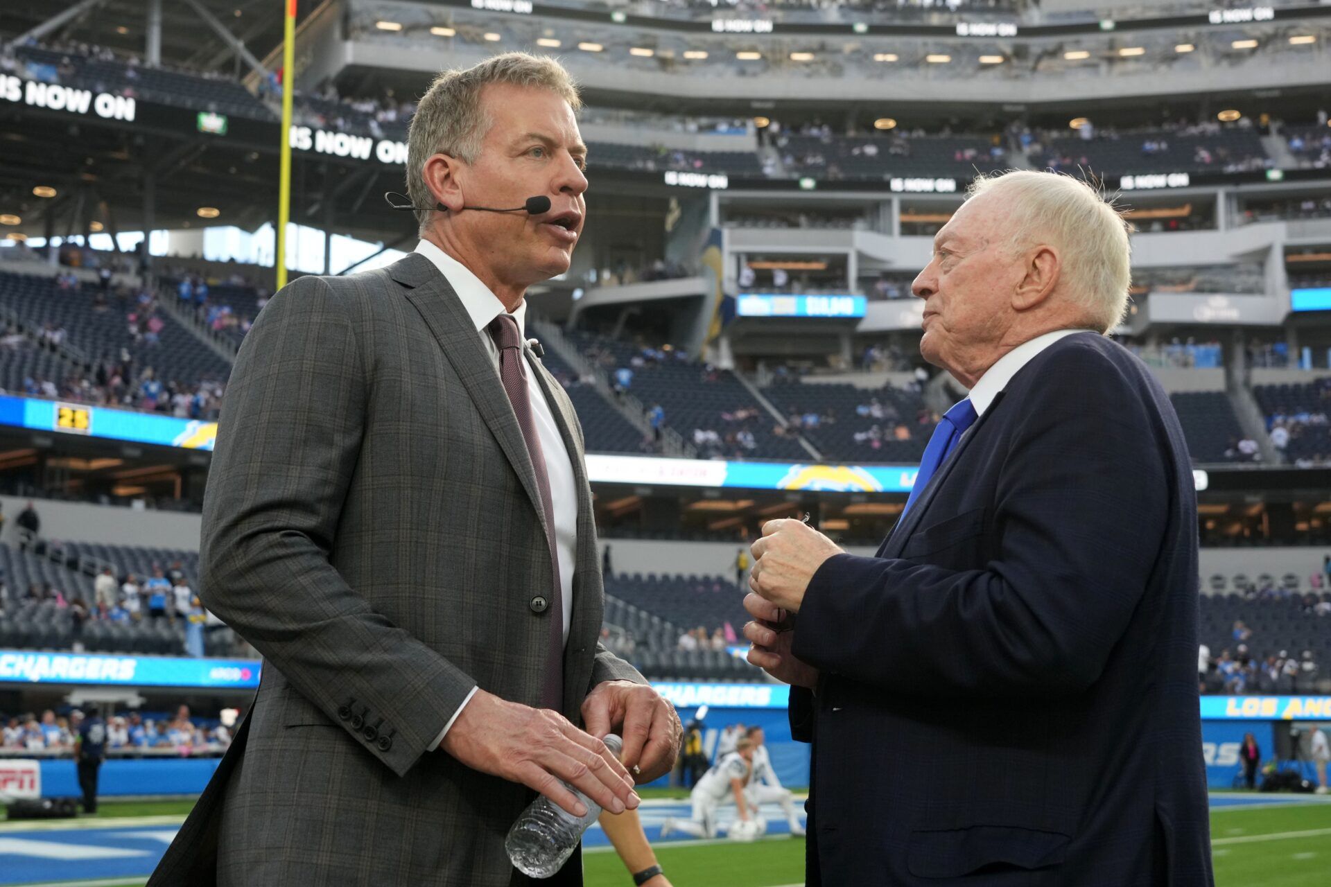 Dallas Cowboys owner Jerry Jones (right) talks with former quarterback Troy Aikman before the game against the Los Angeles Chargers at SoFi Stadium.