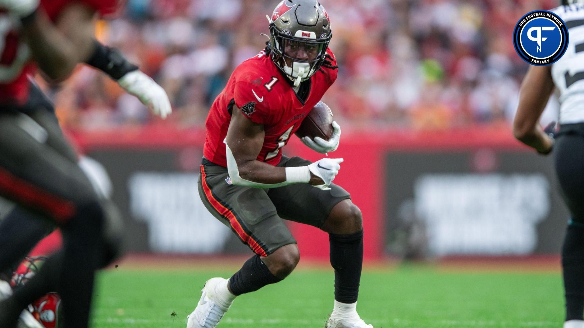 Tampa Bay Buccaneers RB Rachaad White (1) runs with the ball against the Jacksonville Jaguars.