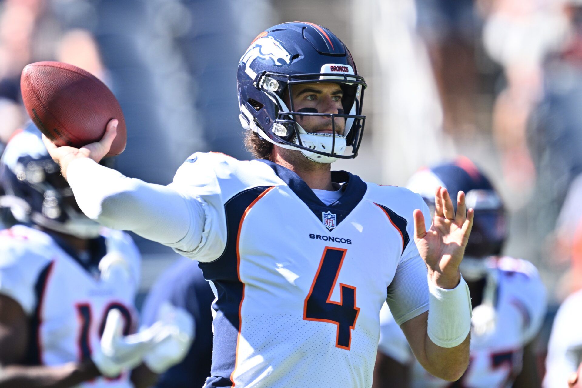 Denver Broncos quarterback Jarrett Stidham (4) warms up before a game against the Chicago Bears at Soldier Field.