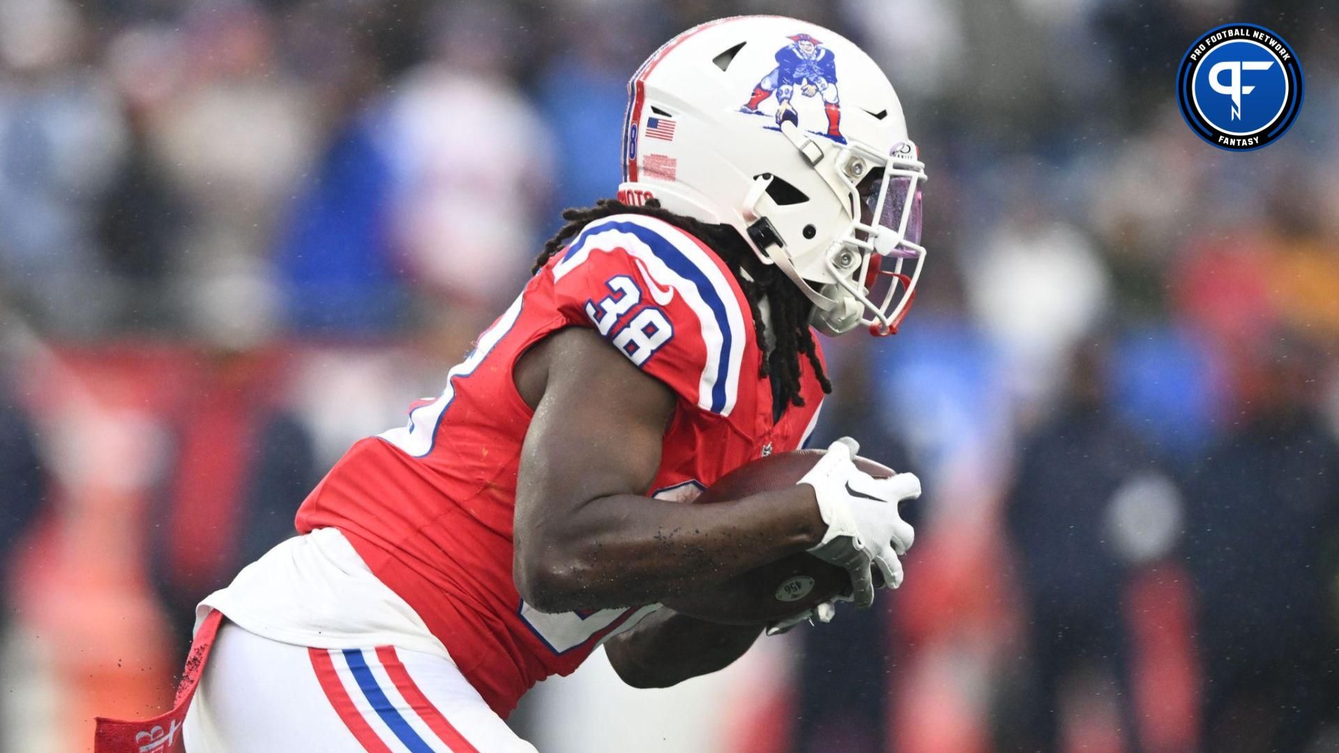 New England Patriots running back Rhamondre Stevenson (38) rushes against the Los Angeles Chargers during the first half at Gillette Stadium.