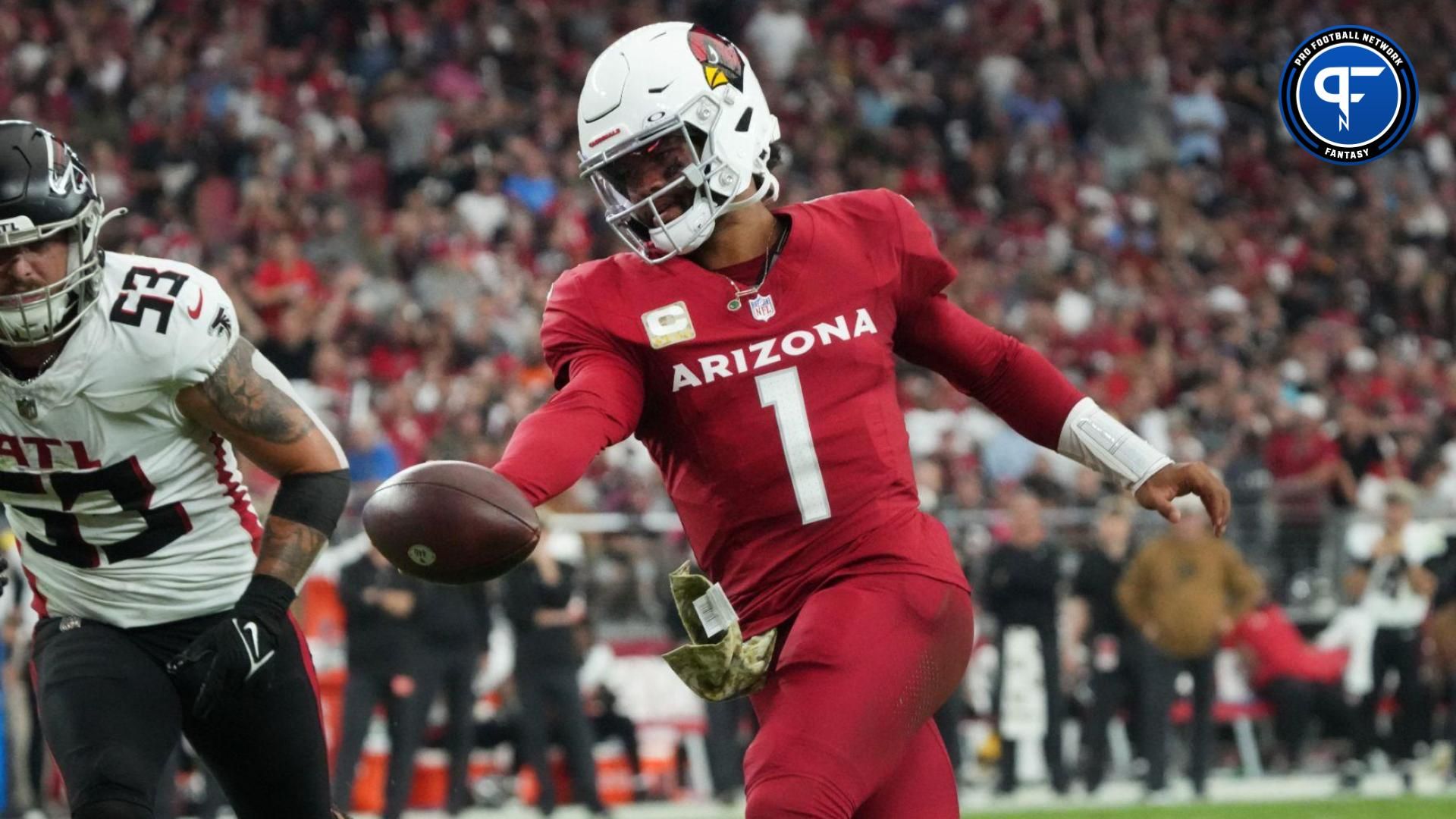 Arizona Cardinals quarterback Kyler Murray (1) runs the ball in for a touchdown past Atlanta Falcons linebacker Nate Landman (53) at State Farm Stadium.