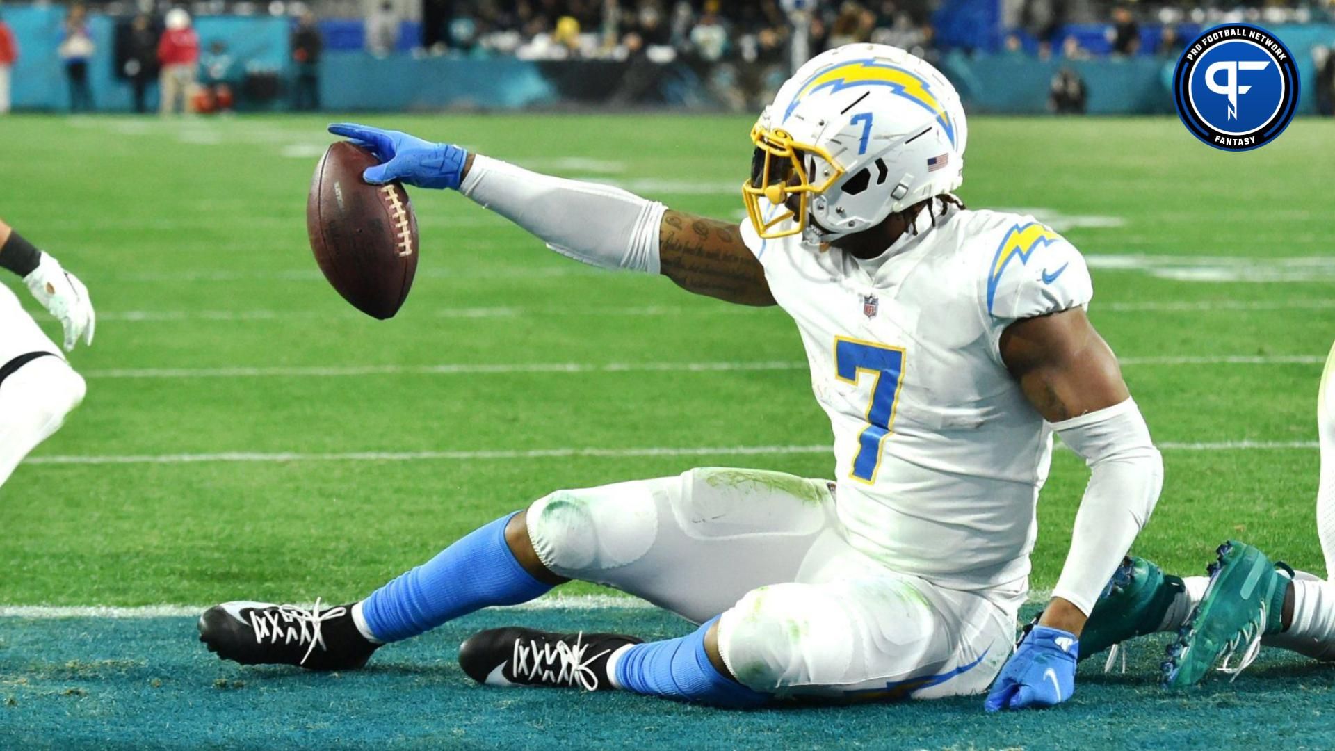 Chargers tight end Gerald Everett (7) points to the sideline after pulling in a touchdown while being defended by Jacksonville Jaguars linebacker Chad Muma (48) during second quarter action. The Jacksonville Jaguars hosted the Los Angeles Chargers in their first round playoff game Saturday, January 14, 2023 at TIAA Bank Field in Jacksonville, Fla.