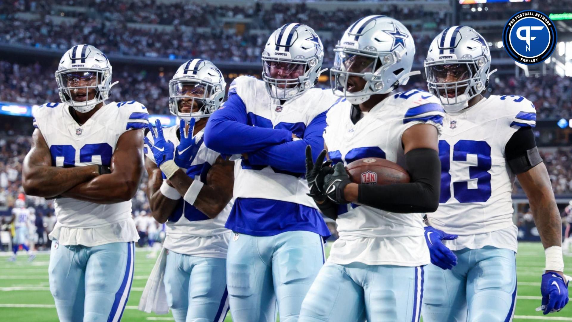 Dallas Cowboys cornerback DaRon Bland (26) celebrates with teammates after intercepting a pass during the second half against the New England Patriots at AT&T Stadium.