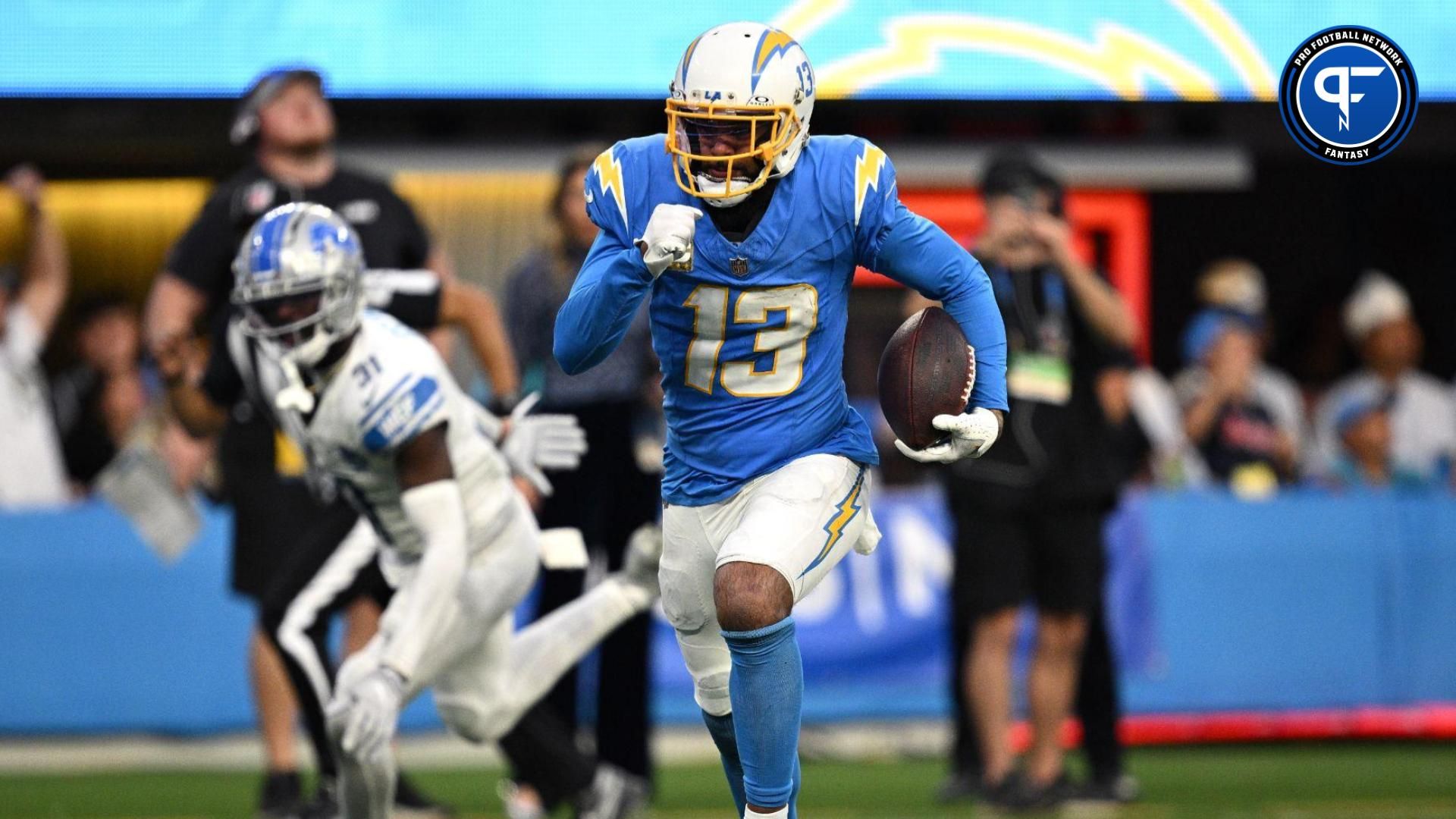 Los Angeles Chargers wide receiver Keenan Allen (13) runs the ball for a touchdown after a catch against the Detroit Lions during the second half at SoFi Stadium.