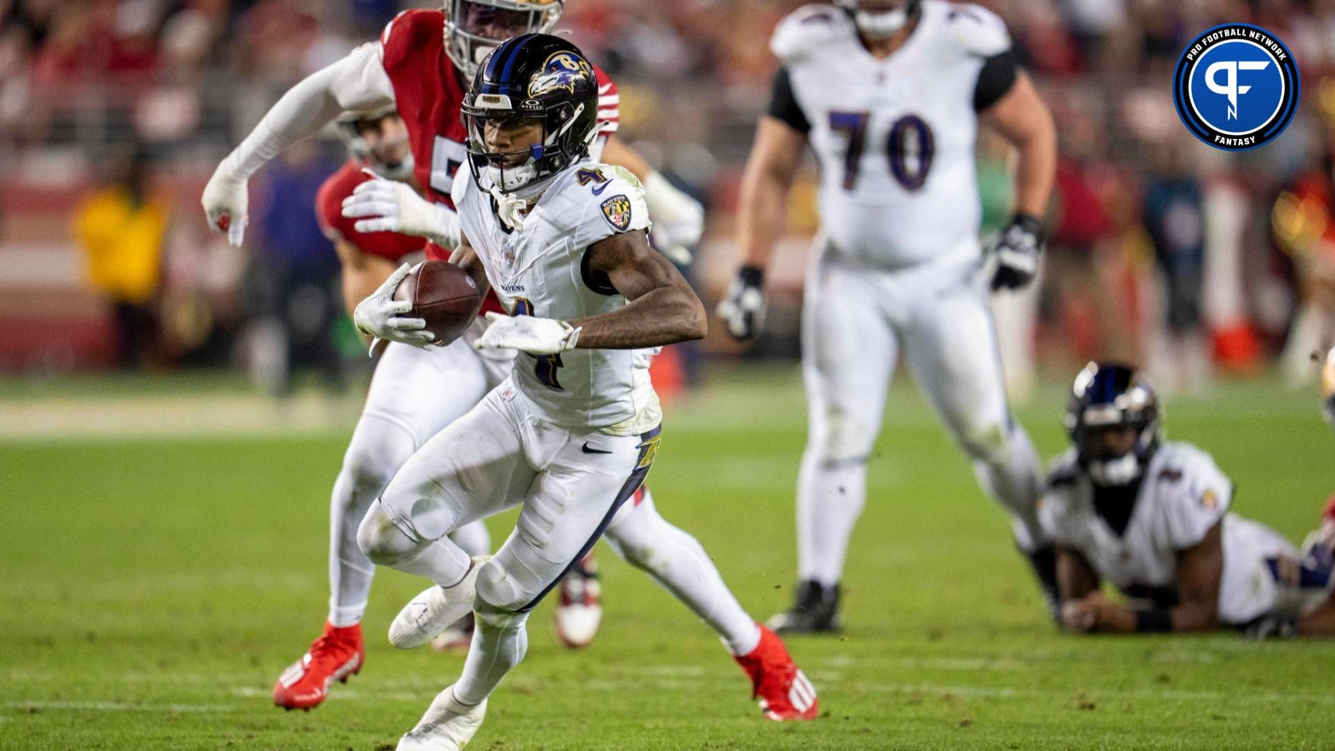 Baltimore Ravens wide receiver Zay Flowers (4) rushes for the first down against San Francisco 49ers during the third quarter at Levi's Stadium.