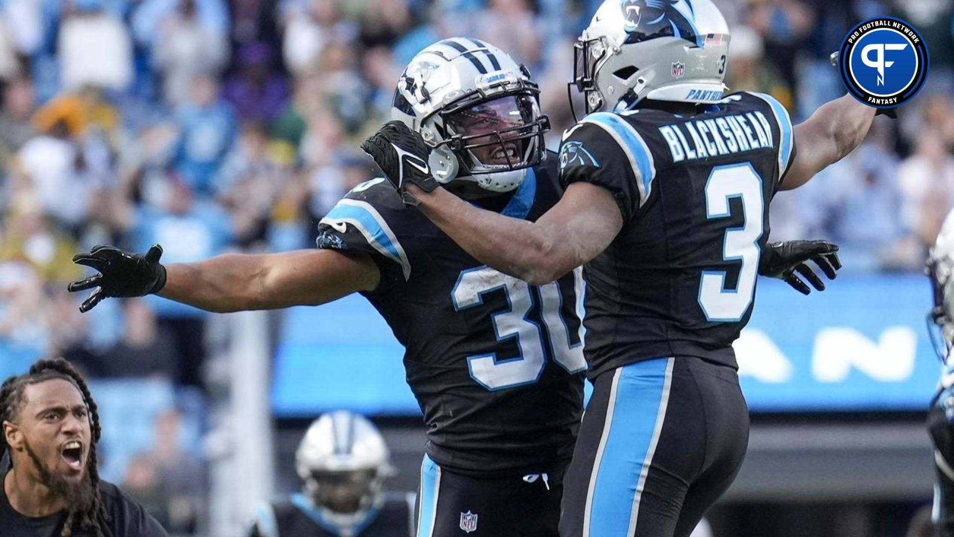 Carolina Panthers running back Raheem Blackshear (3) and running back Chuba Hubbard (30) react to a score against the Green Bay Packers during the second half at Bank of America Stadium.