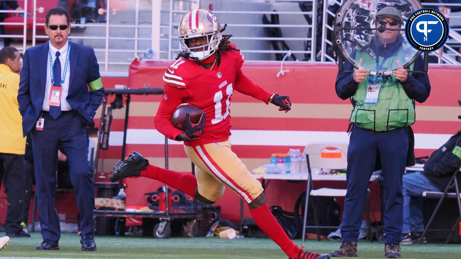 San Francisco 49ers wide receiver Brandon Aiyuk (11) runs after a catch for a 76-yard touchdown against the Tampa Bay Buccaneers during the third quarter at Levi's Stadium.