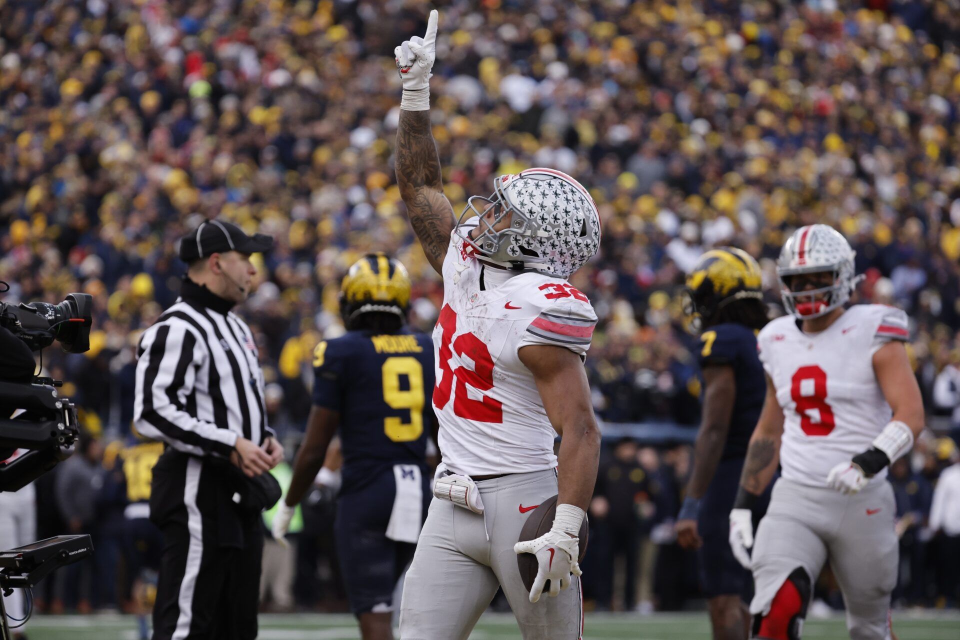 Ohio State Buckeyes running back TreVeyon Henderson (32) celebrates after he scores a touchdown in the second half against the Michigan Wolverines at Michigan Stadium.