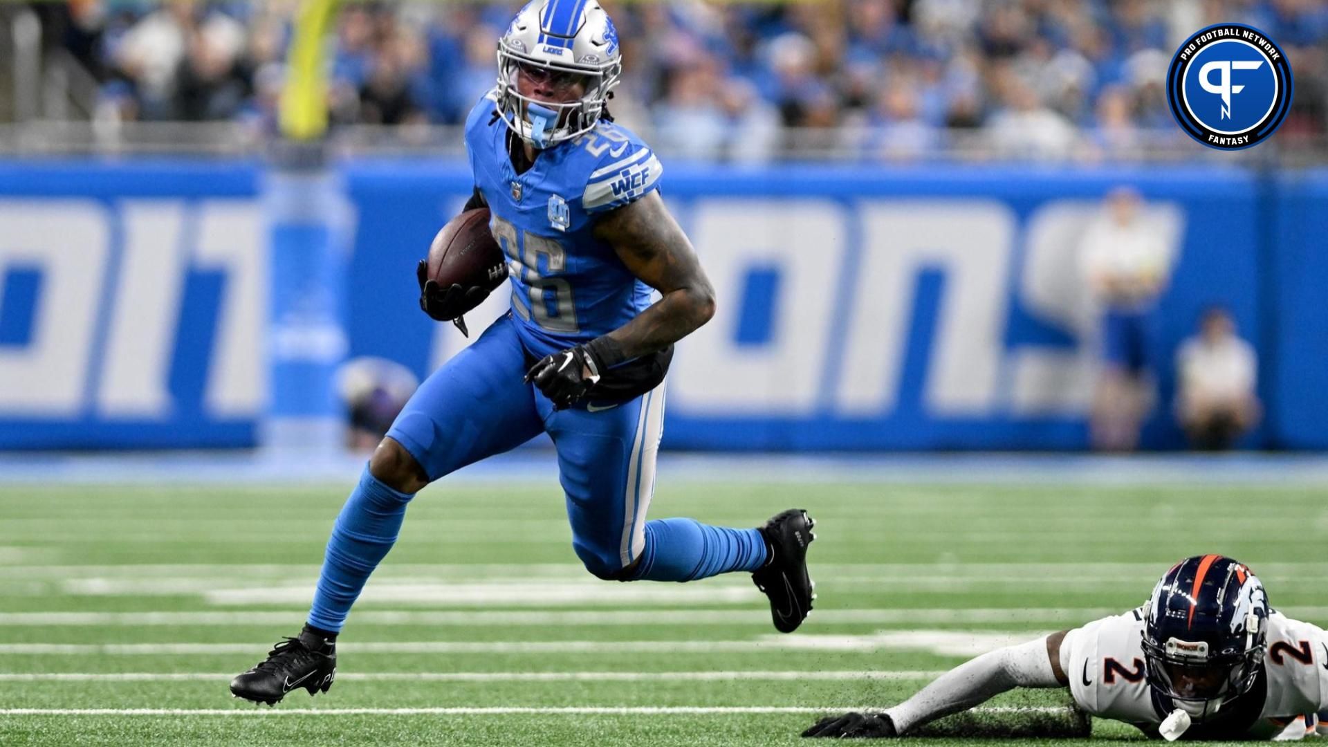 Detroit Lions running back Jahmyr Gibbs (26) runs with the football against the Denver Broncos in the third quarter at Ford Field.