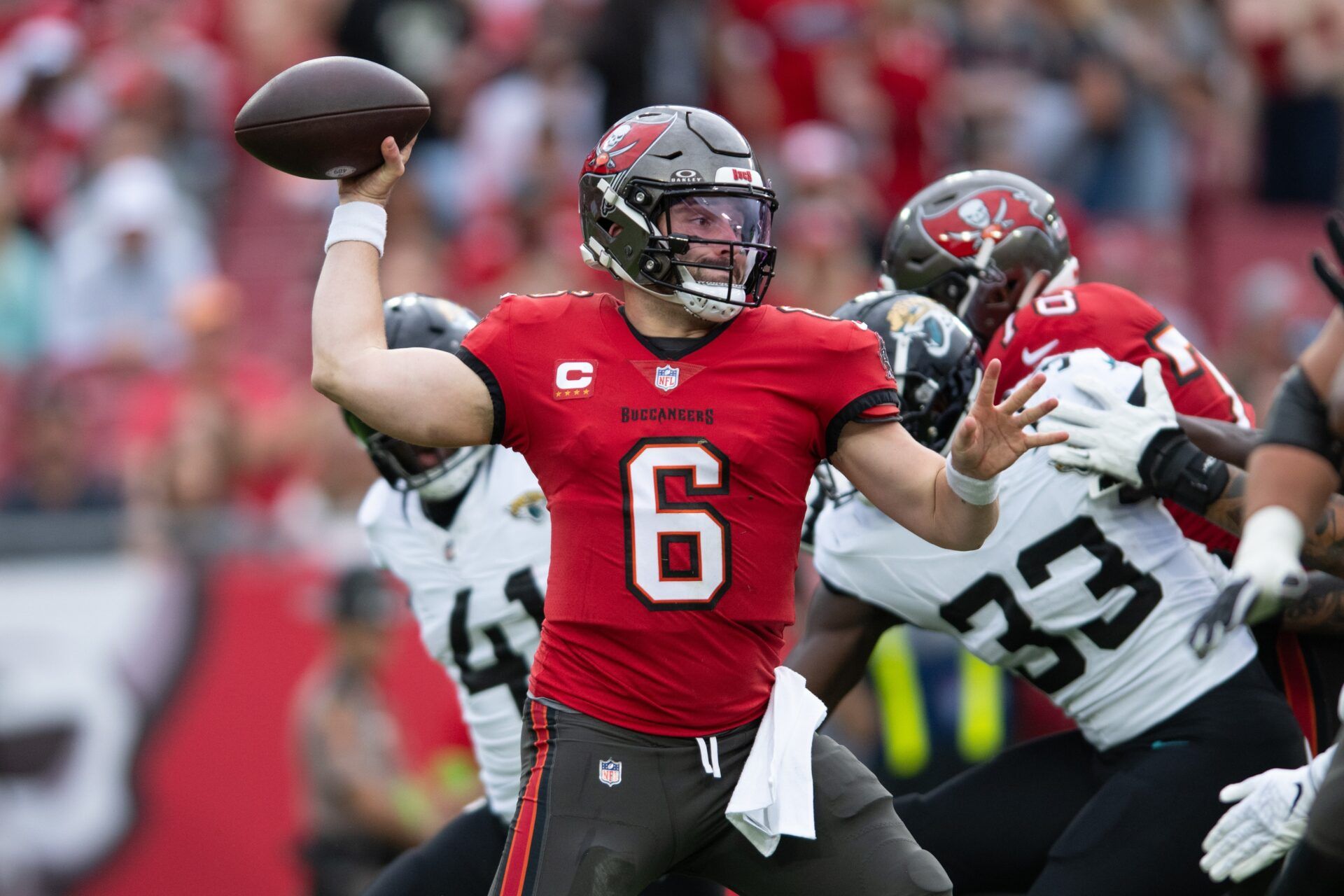 Tampa Bay Buccaneers quarterback Baker Mayfield (6) throws the ball against the Jacksonville Jaguars in the first quarter at Raymond James Stadium.