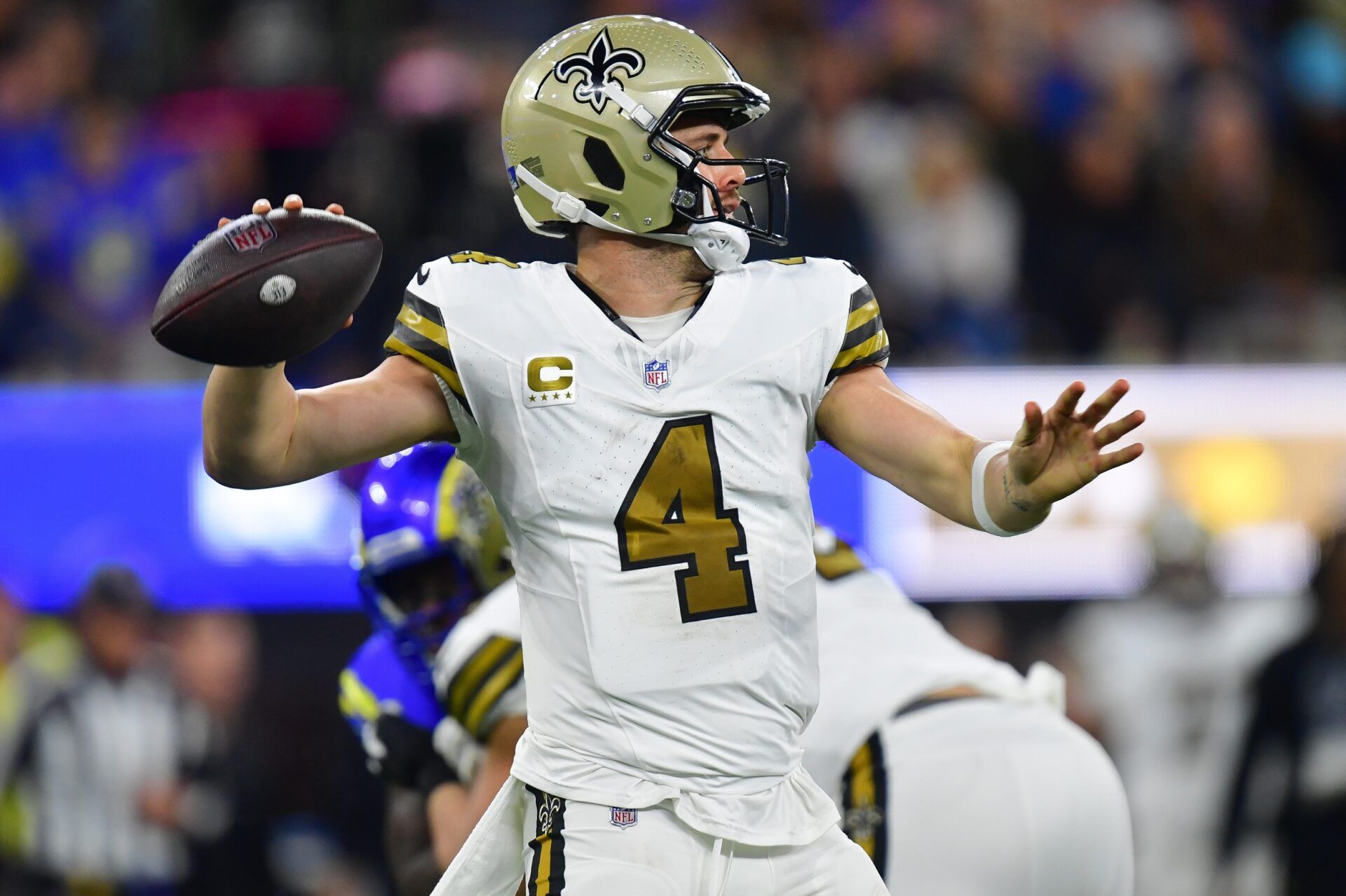 New Orleans Saints quarterback Derek Carr (4) throws against the Los Angeles Rams during the first half at SoFi Stadium.