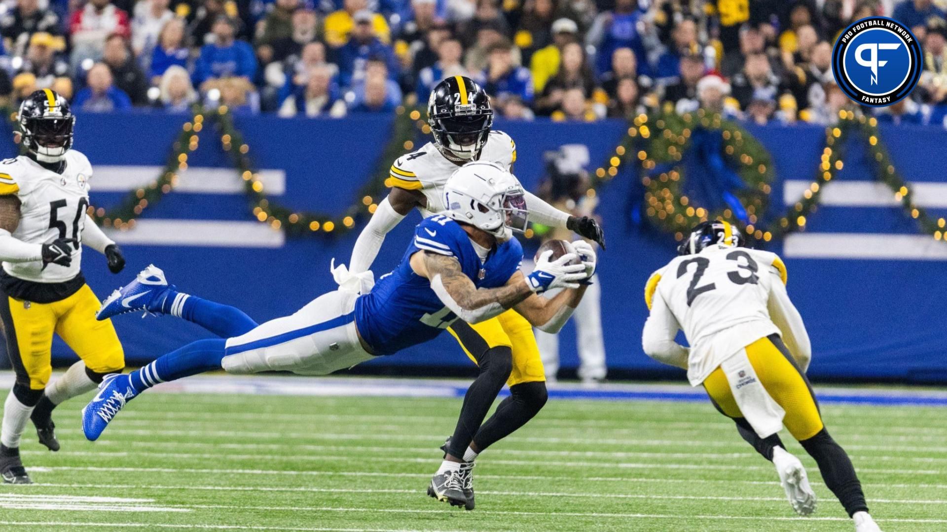 Indianapolis Colts wide receiver Michael Pittman Jr. (11) dives for a catch while Pittsburgh Steelers safety Damontae Kazee (23) defends in the first half at Lucas Oil Stadium.