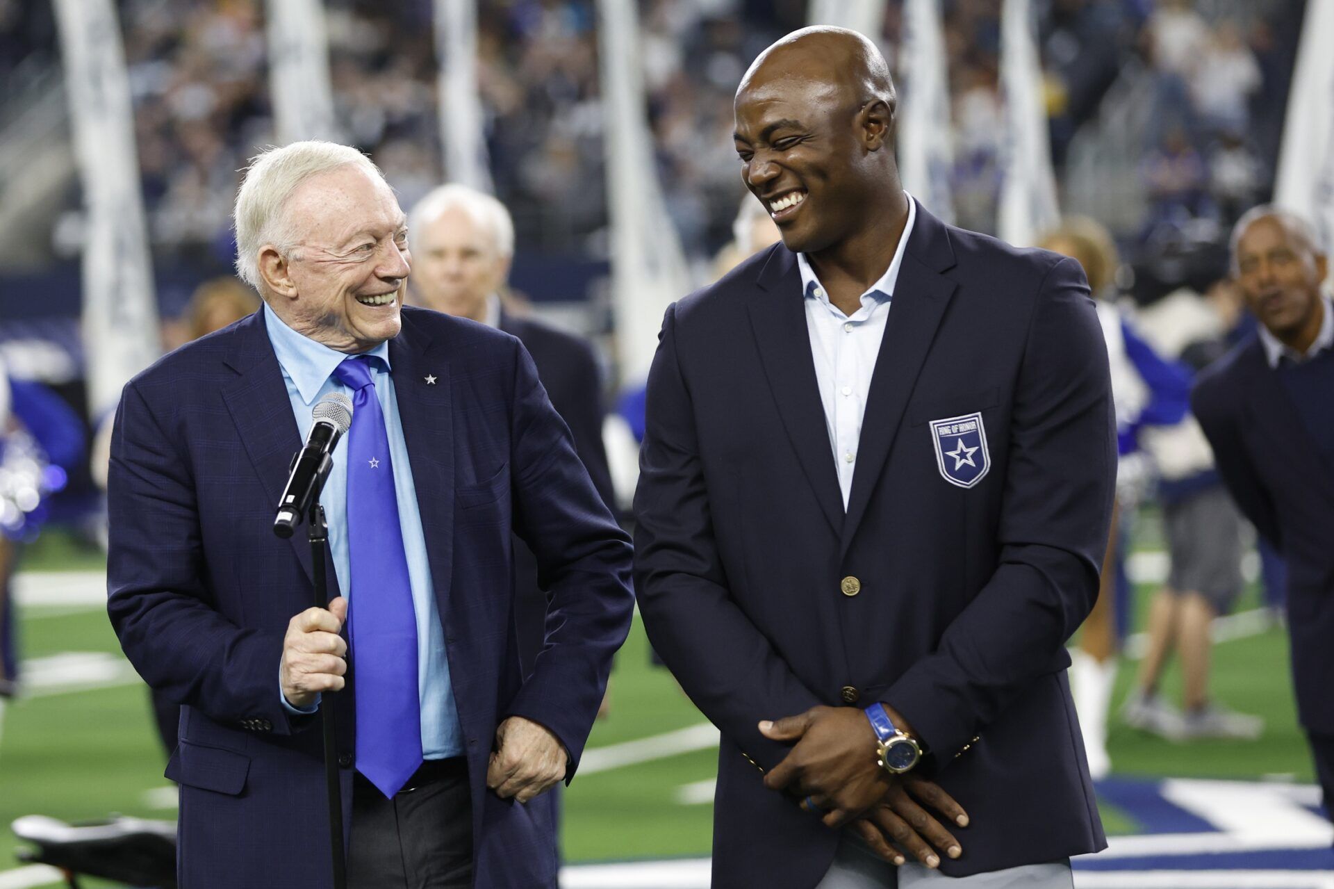 Dallas Cowboys owner Jerry Jones and former player DeMarcus Ware smile during the induction ceremony for the Ring of Honor during half time in the game against the Los Angeles Rams.