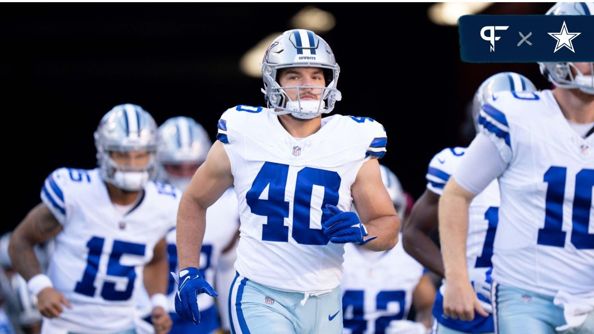 Dallas Cowboys RB Hunter Luepke (40) runs out onto the field with his teammates.