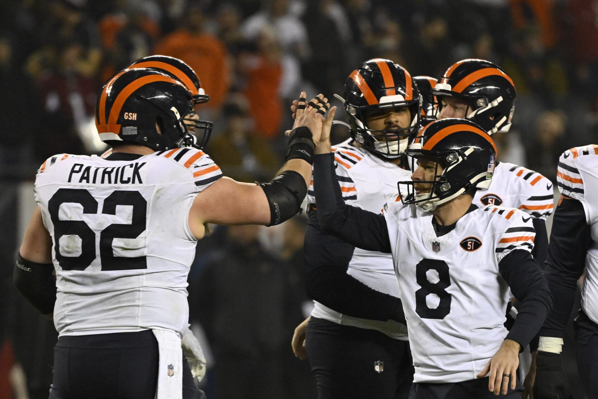 Chicago Bears guard Lucas Patrick (62) and Chicago Bears place kicker Cairo Santos (8) celebrate after Santos kicks a field goal.