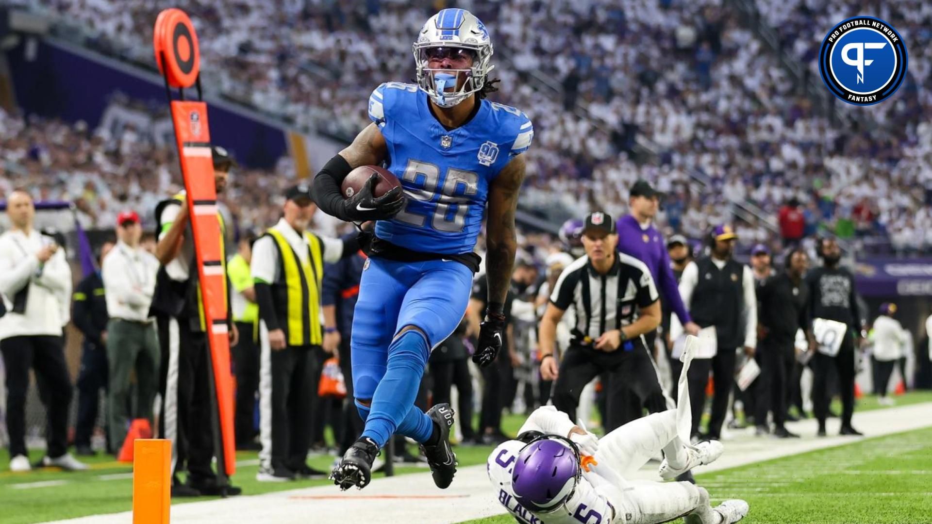 Detroit Lions running back Jahmyr Gibbs (26) runs for a touchdown against the Minnesota Vikings during the second quarter at U.S. Bank Stadium.