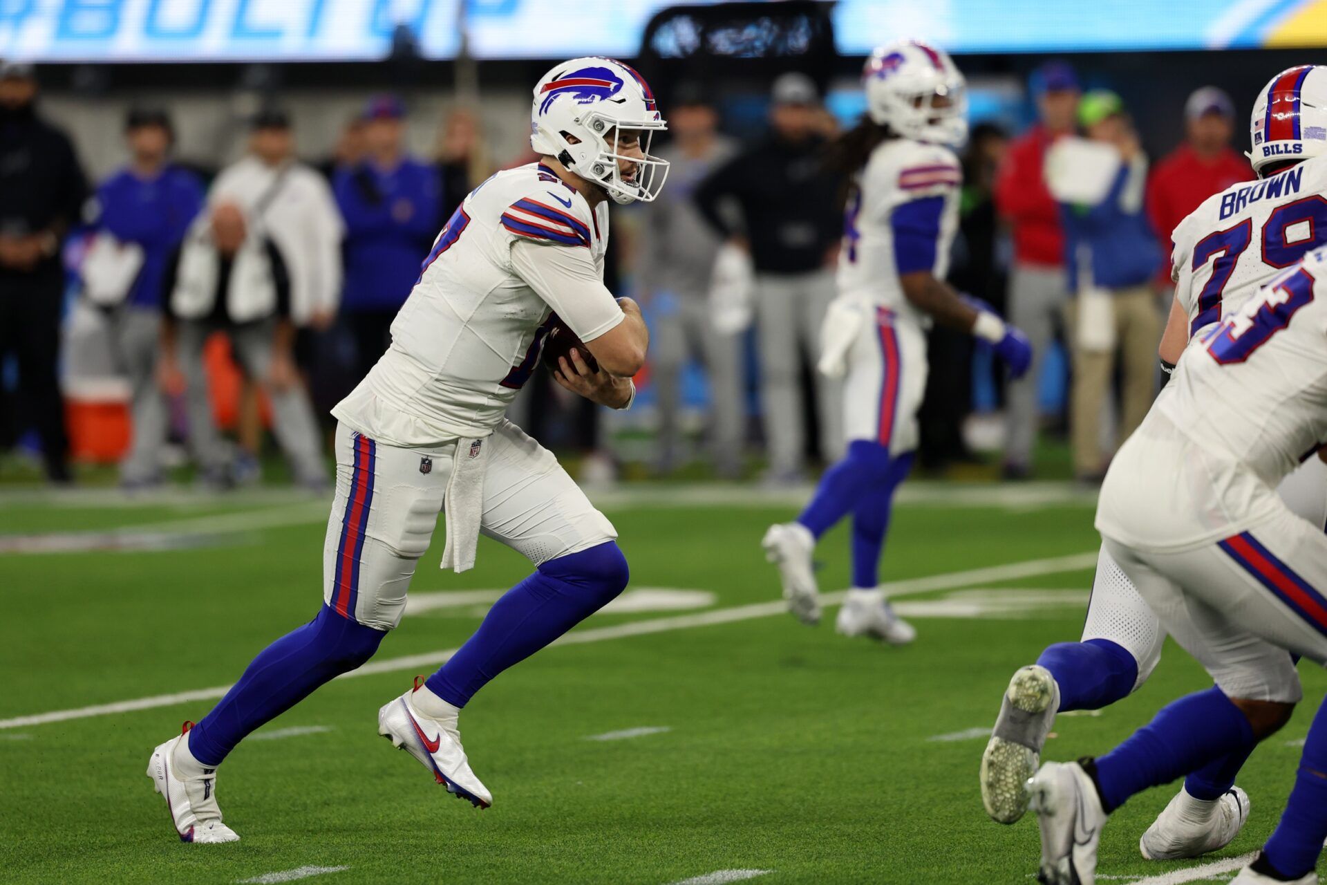 Buffalo Bills quarterback Josh Allen (17) runs with the ball during the fourth quarter against the Los Angeles Chargers at SoFi Stadium.