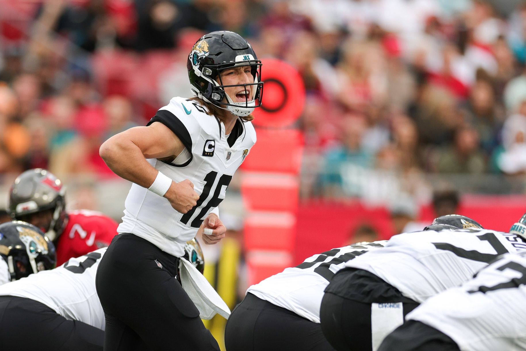 Jacksonville Jaguars quarterback Trevor Lawrence (16) calls a play at the line against the Tampa Bay Buccaneers in the first quarter at Raymond James Stadium.