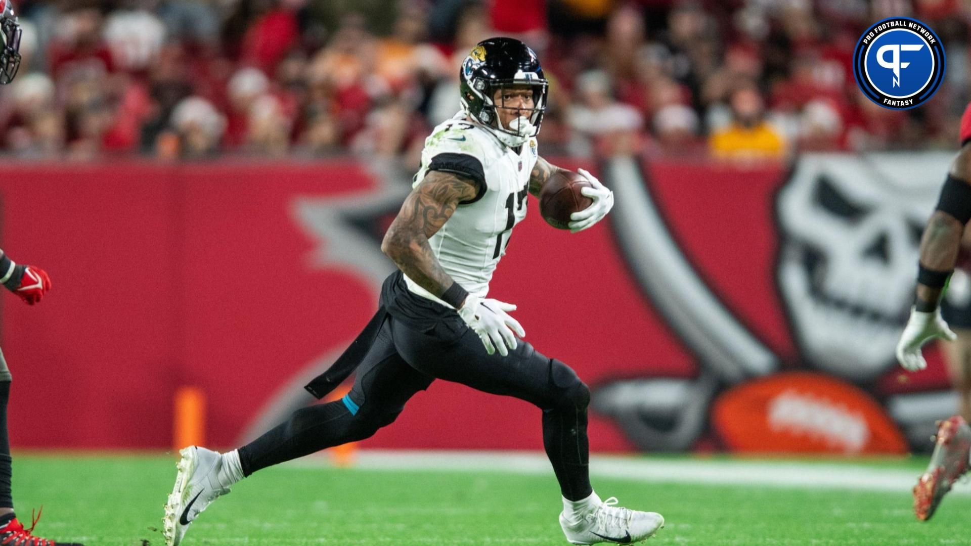 Jacksonville Jaguars tight end Evan Engram (17) runs the ball after the catch against the Tampa Bay Buccaneers in the fourth quarter at Raymond James Stadium.
