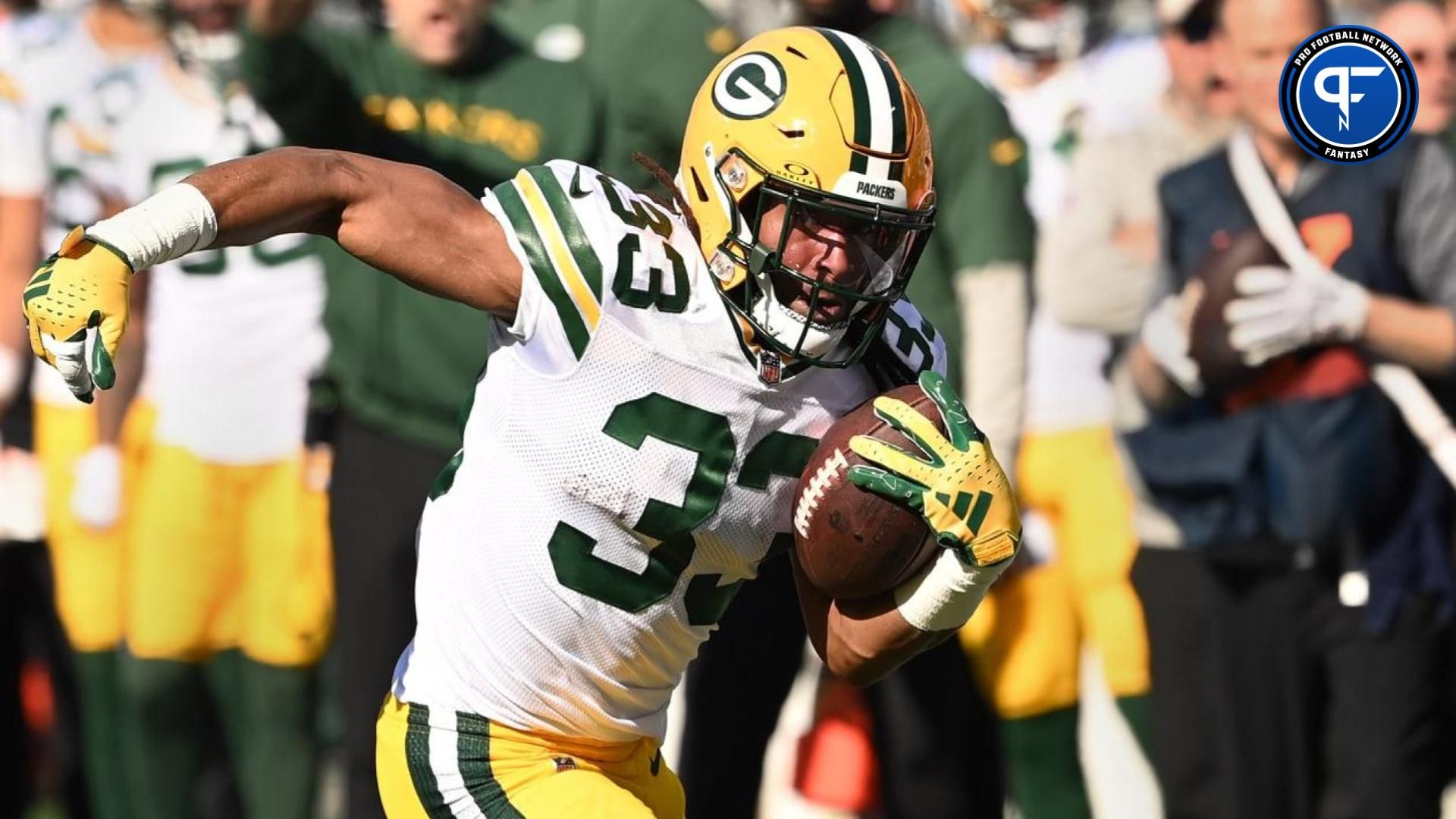 Green Bay Packers running back Aaron Jones (33) with the ball in the first quarter at Bank of America Stadium.