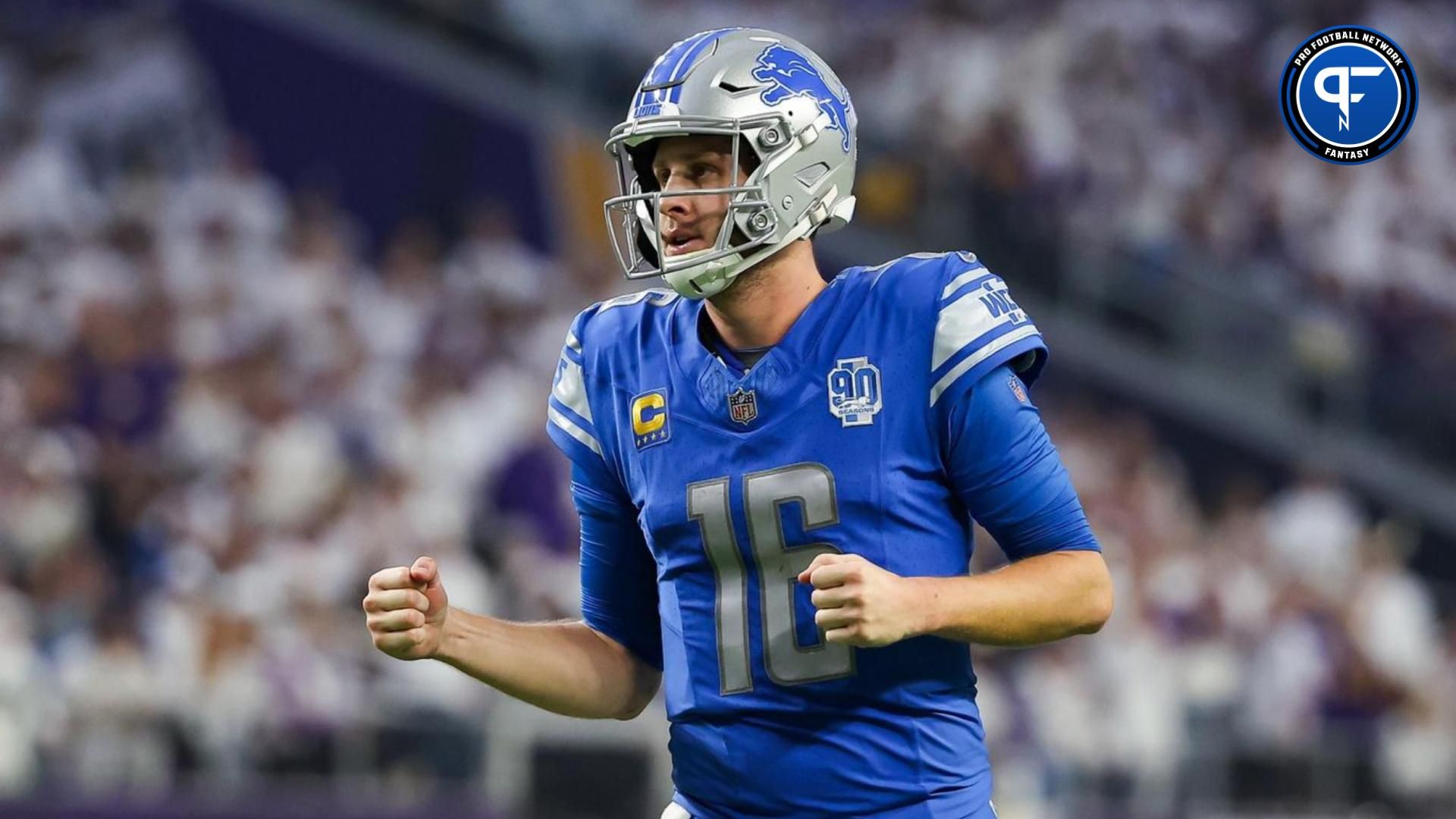 Detroit Lions quarterback Jared Goff (16) celebrates after running back Jahmyr Gibbs (26) runs for a touchdown against the Minnesota Vikings during the fourth quarter at U.S. Bank Stadium.