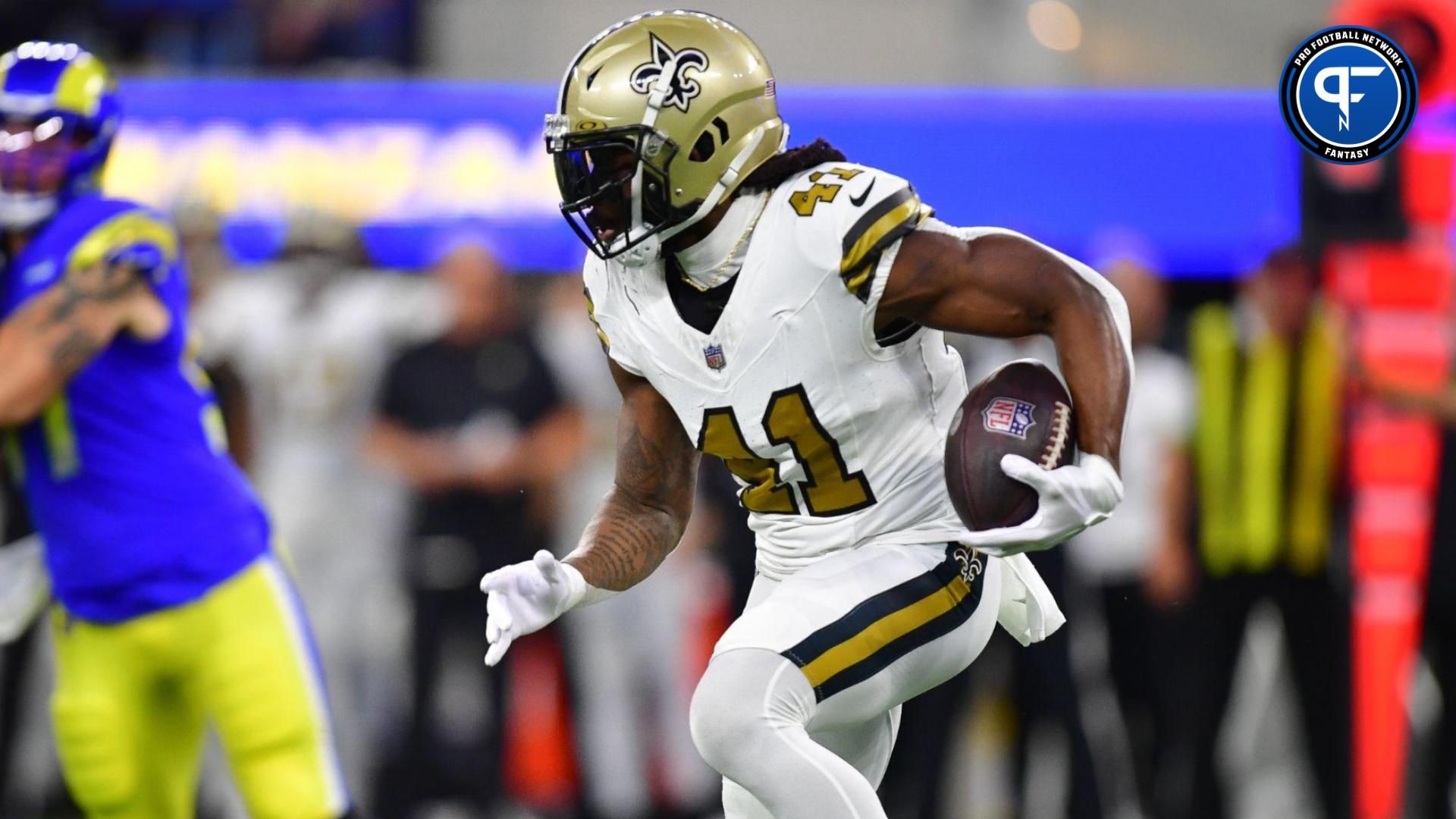 New Orleans Saints running back Alvin Kamara (41) runs the ball against the Los Angeles Rams during the first half at SoFi Stadium.