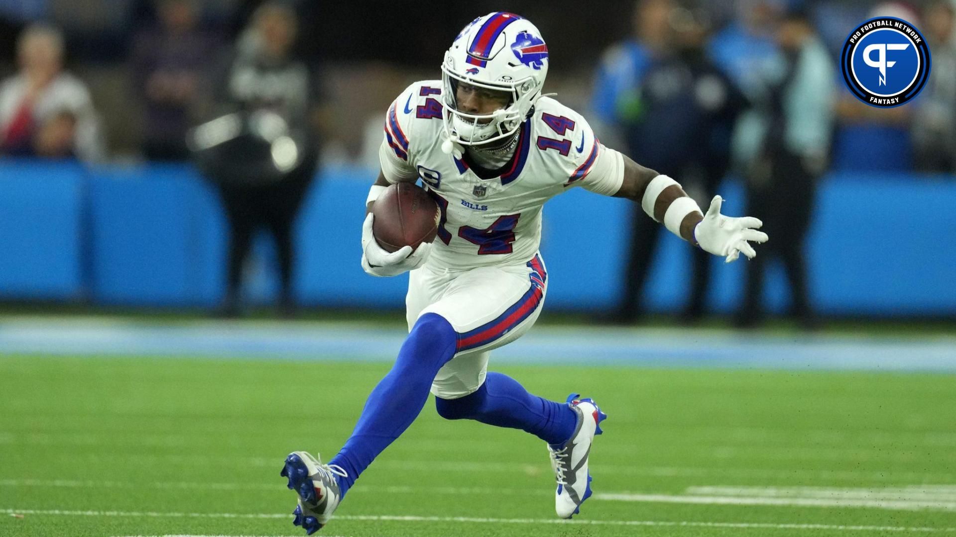 Buffalo Bills wide receiver Stefon Diggs (14) carries the ball against the Los Angeles Chargers in the second half at SoFi Stadium.