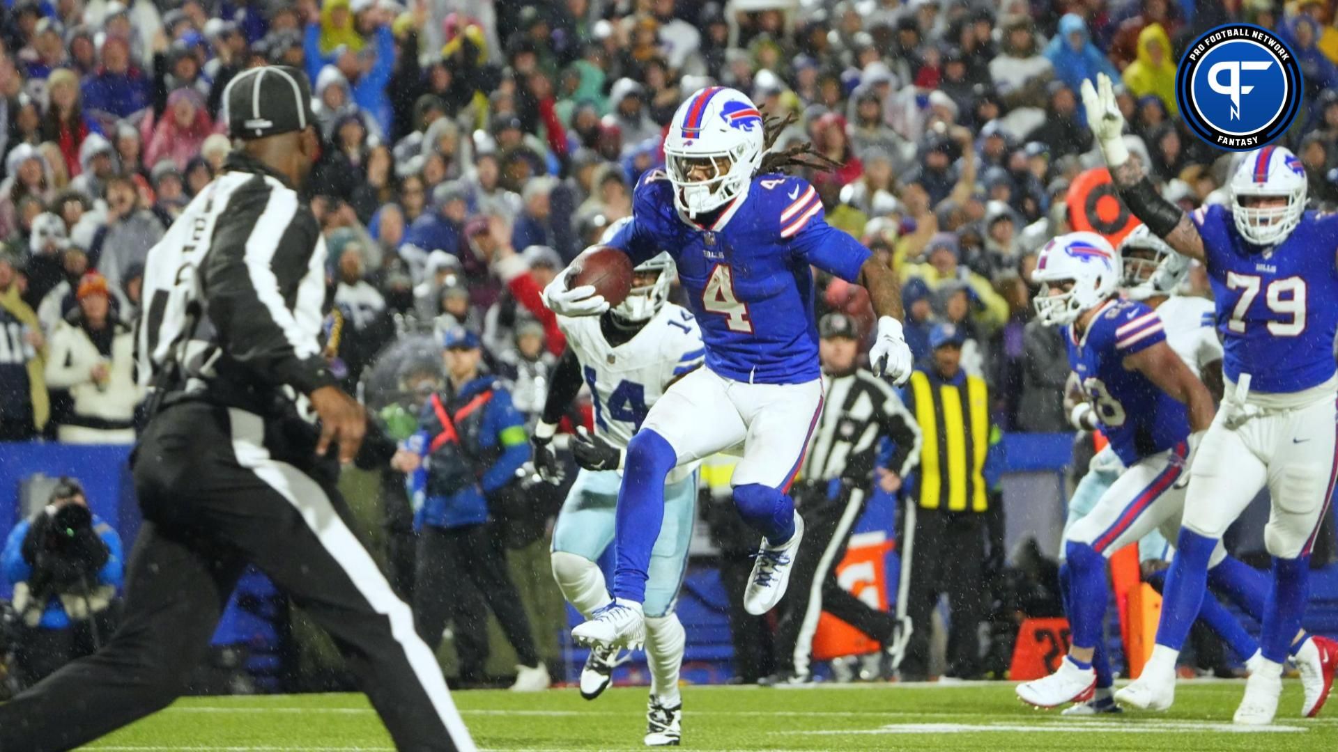 Buffalo Bills running back James Cook (4) runs the ball in for a touch down in the second half against the Dallas Cowboys at Highmark Stadium.