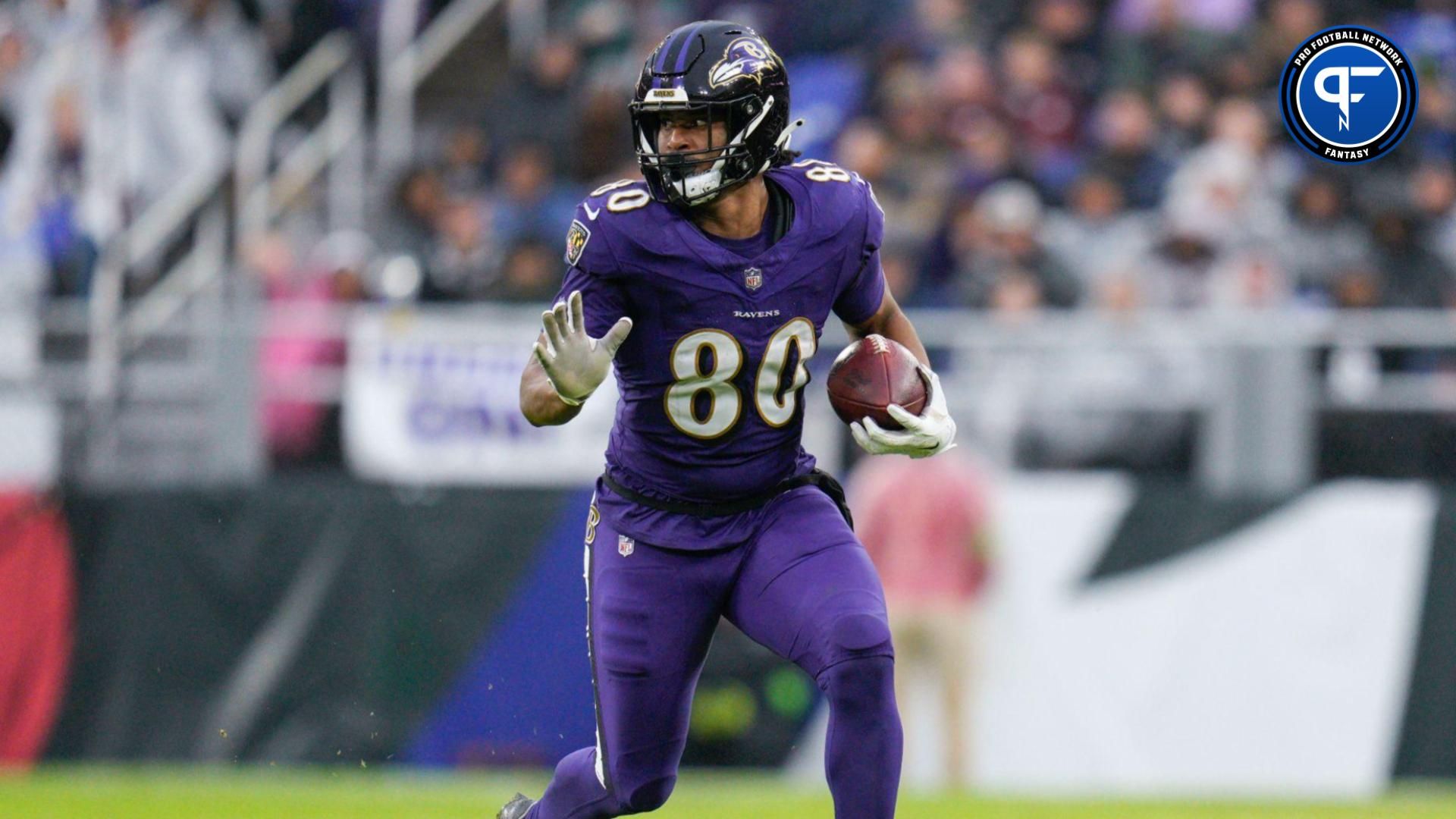 Baltimore Ravens tight end Isaiah Likely (80) runs with the ball against the Los Angeles Rams during the second half at M&T Bank Stadium.