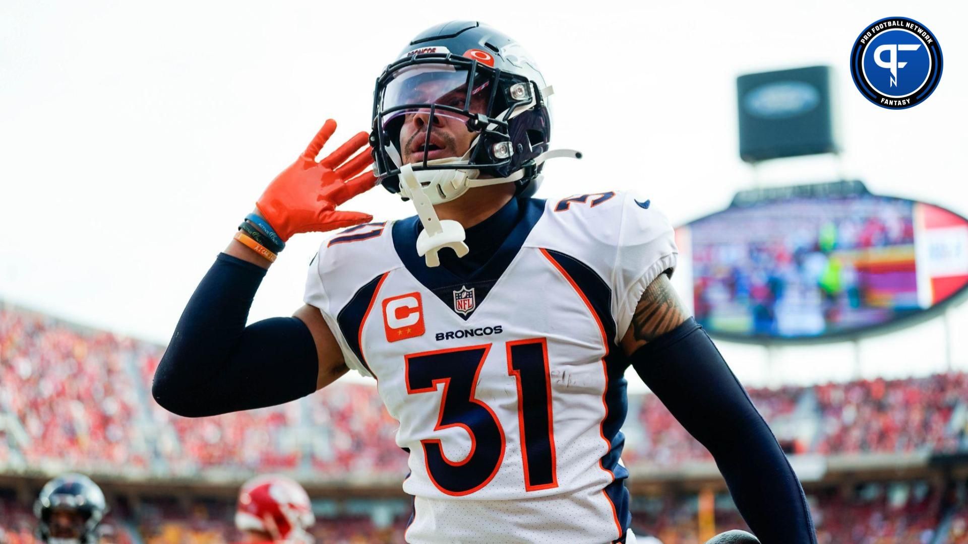 Denver Broncos safety Justin Simmons (31) celebrates after an interception during the first half against the Kansas City Chiefs at GEHA Field at Arrowhead Stadium.