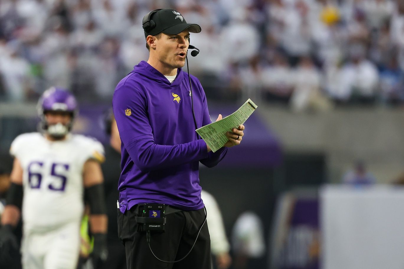 Minnesota Vikings head coach Kevin O'Connell celebrates after Minnesota Vikings running back Ty Chandlers (32) touchdown against the Detroit Lions during the first quarter at U.S. Bank Stadium.