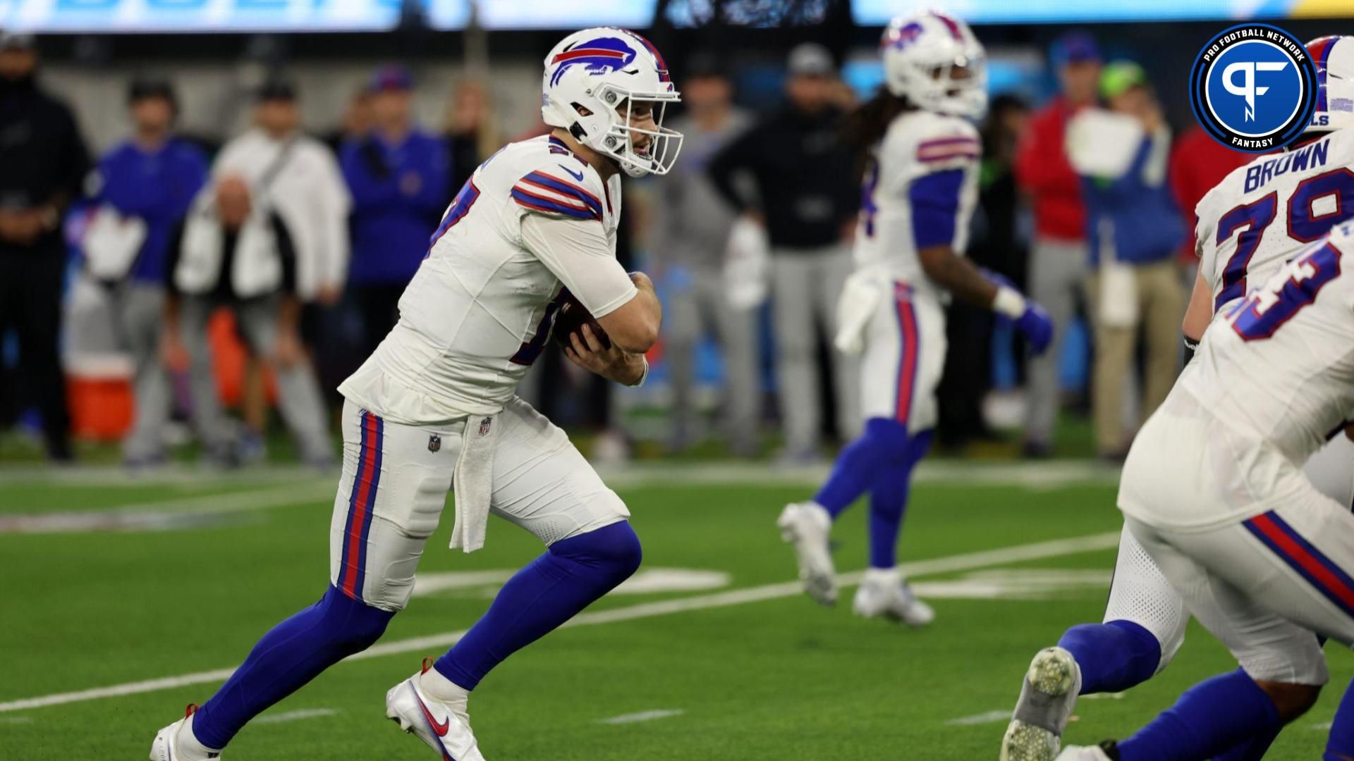 Buffalo Bills quarterback Josh Allen (17) runs with the ball during the fourth quarter against the Los Angeles Chargers at SoFi Stadium.