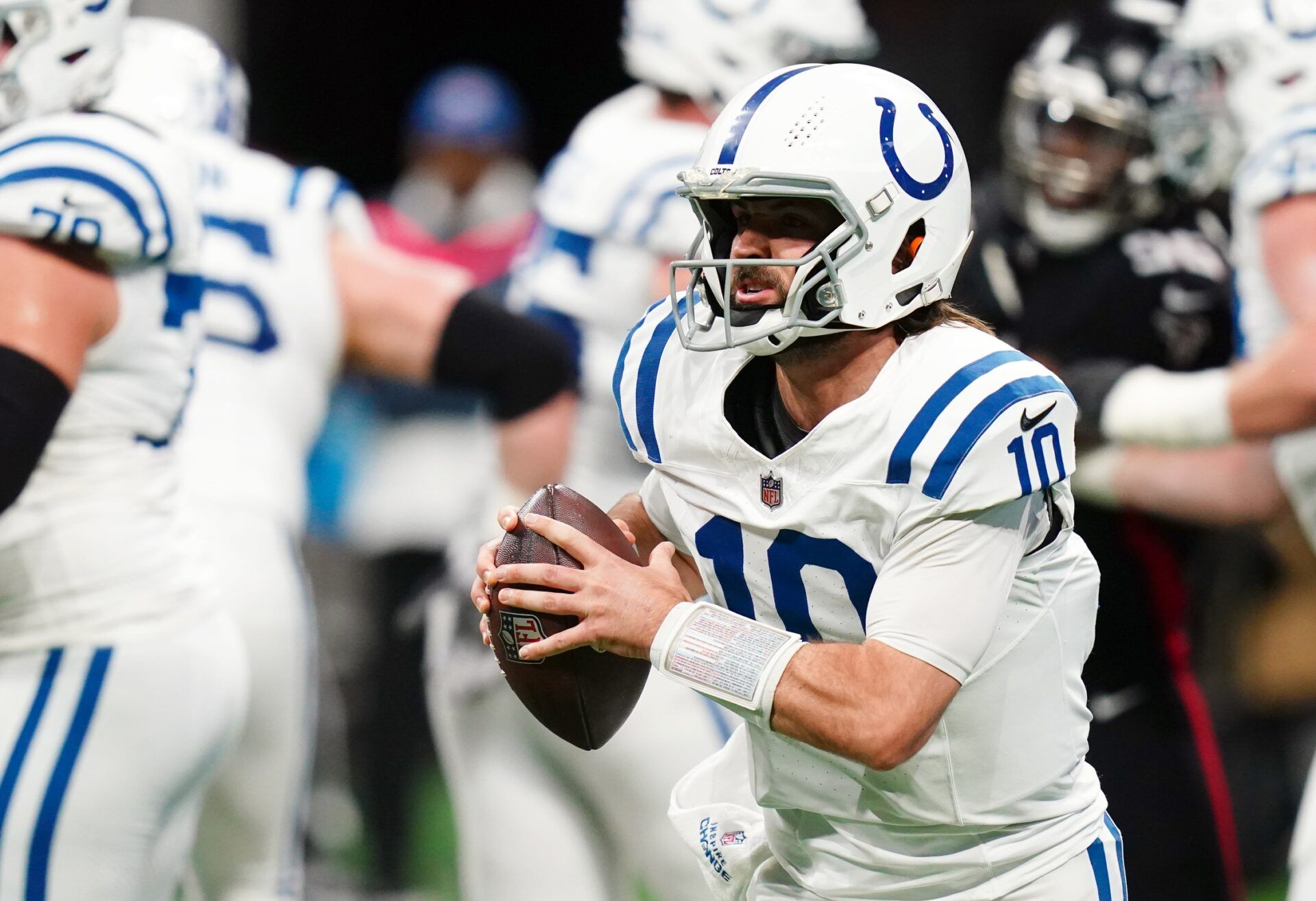 Indianapolis Colts quarterback Gardner Minshew (10) rolls out against the Atlanta Falcons during the first half at Mercedes-Benz Stadium.